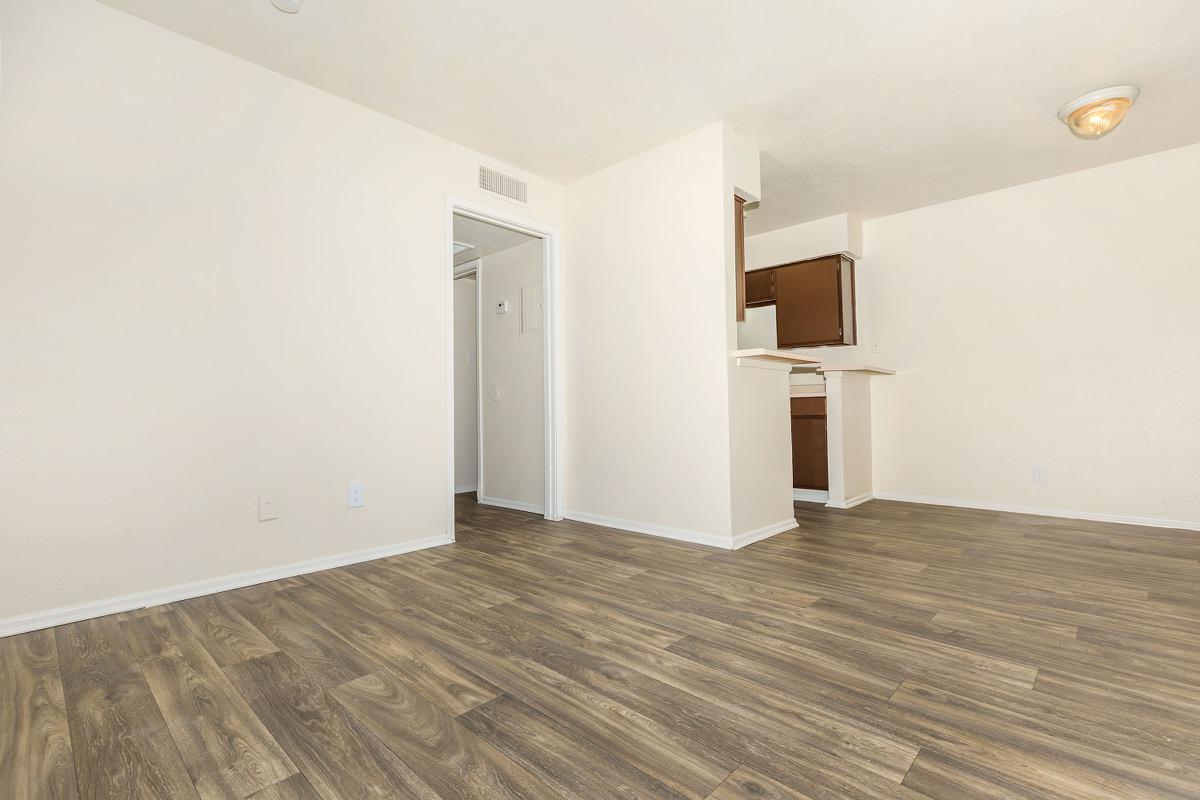 a large white building with a wooden floor