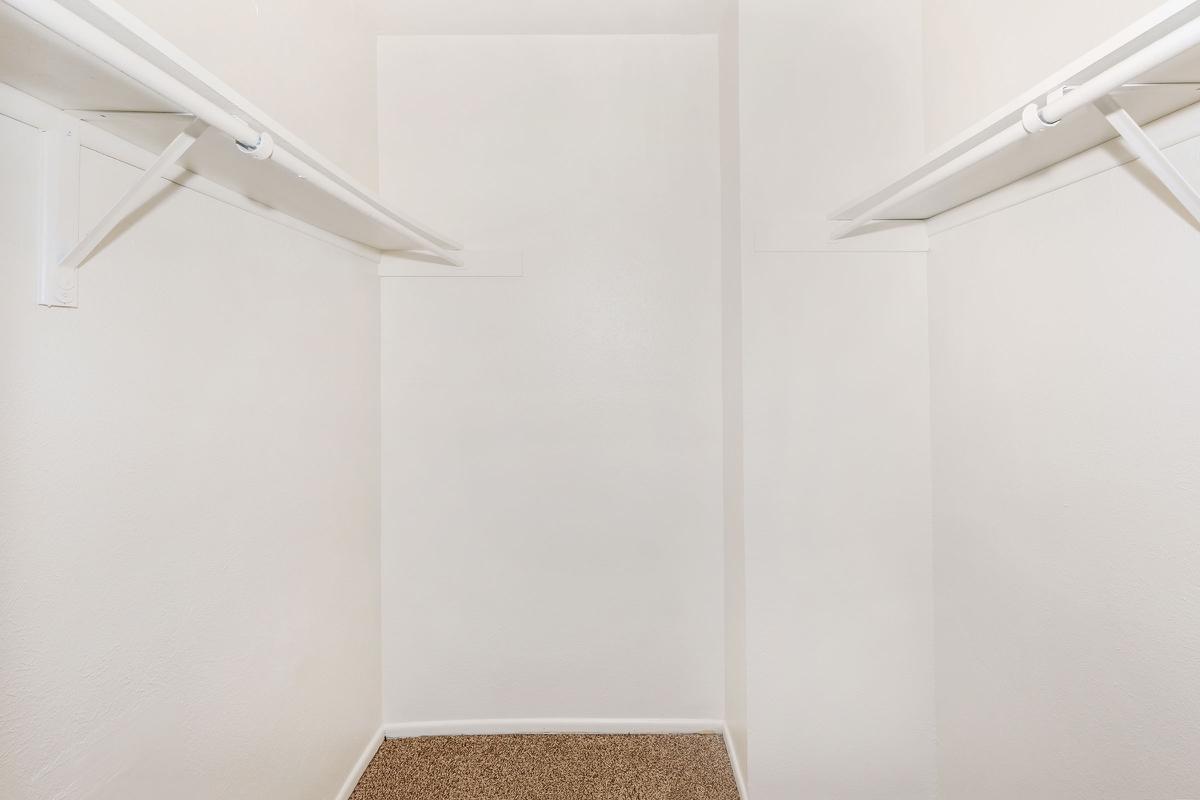 a white tub sitting next to a shower