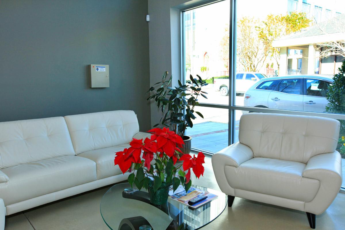 a living room filled with furniture and a large window