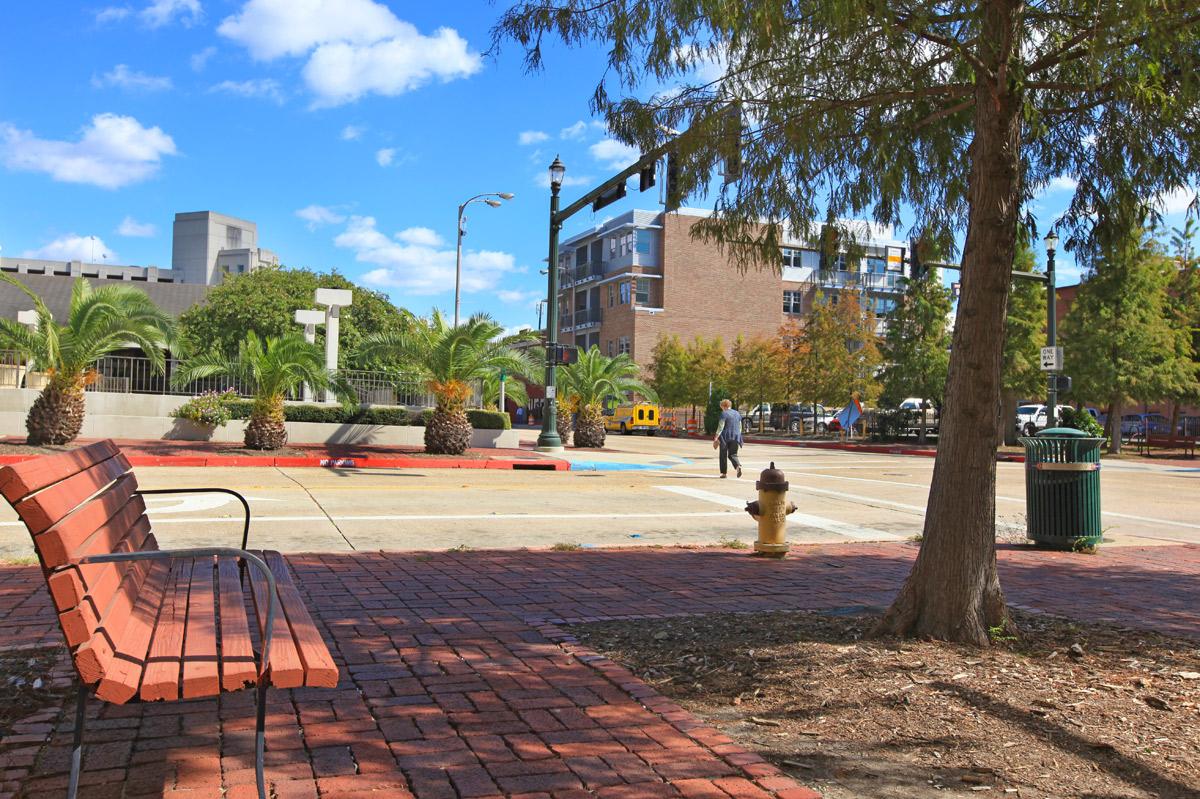 a bench on the side of the street