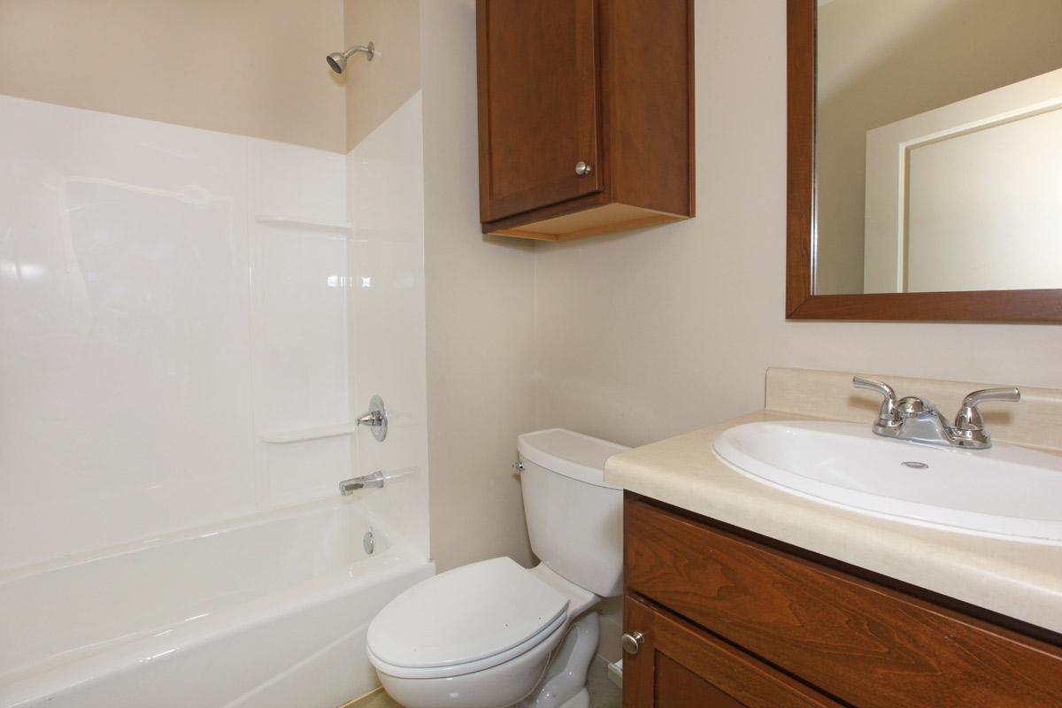 a large white tub sitting next to a sink