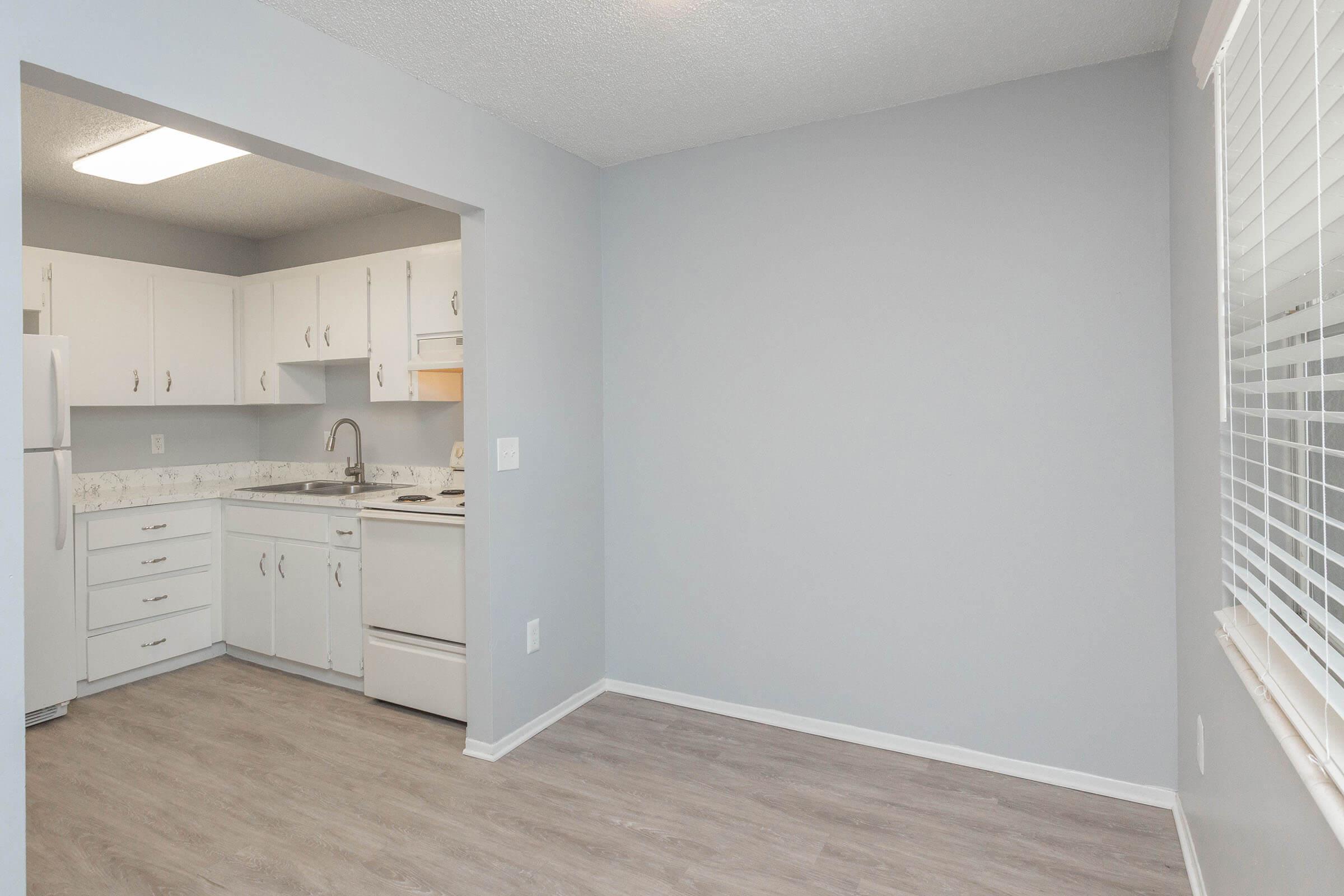 a kitchen with a sink and a refrigerator