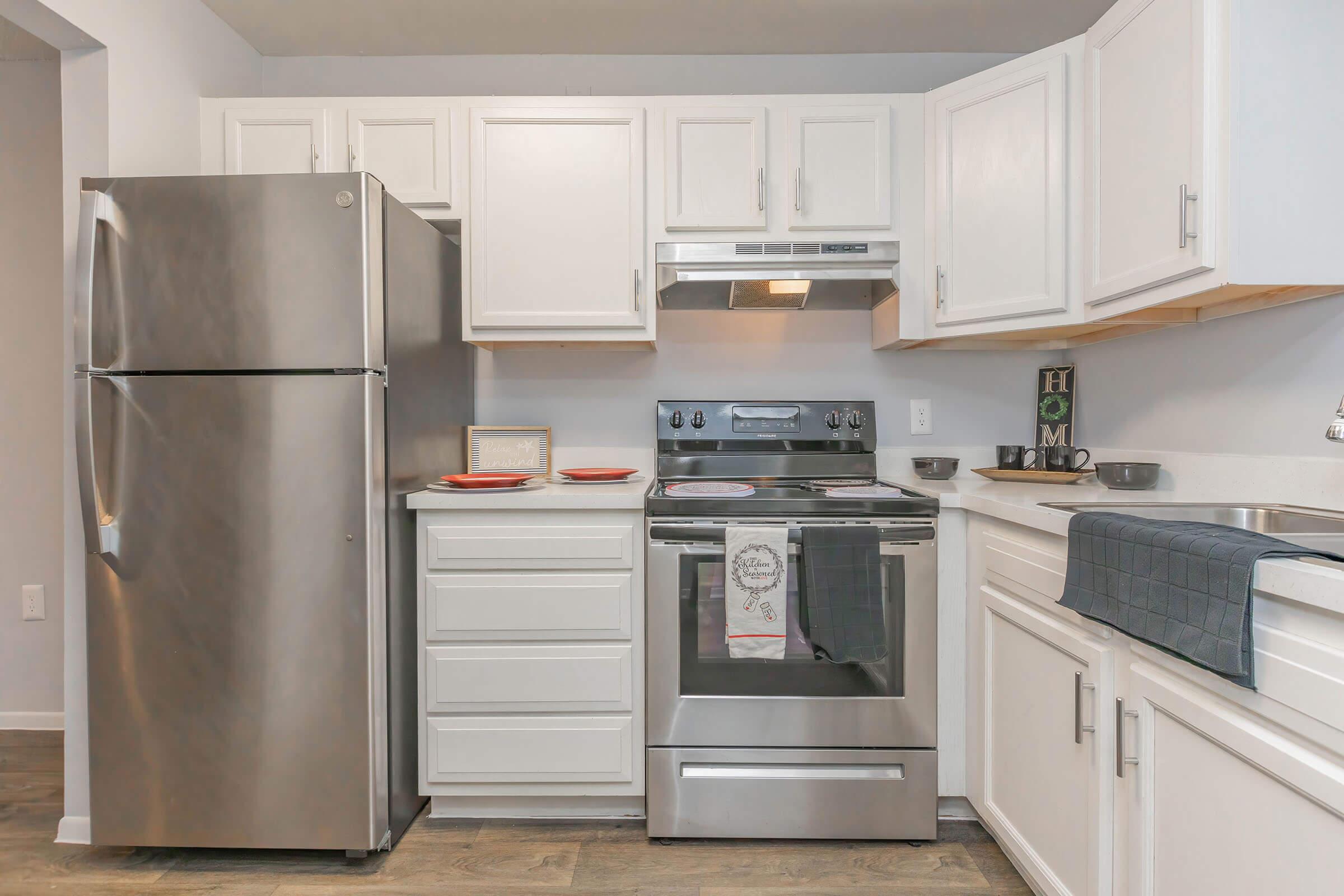 a stainless steel refrigerator in a kitchen