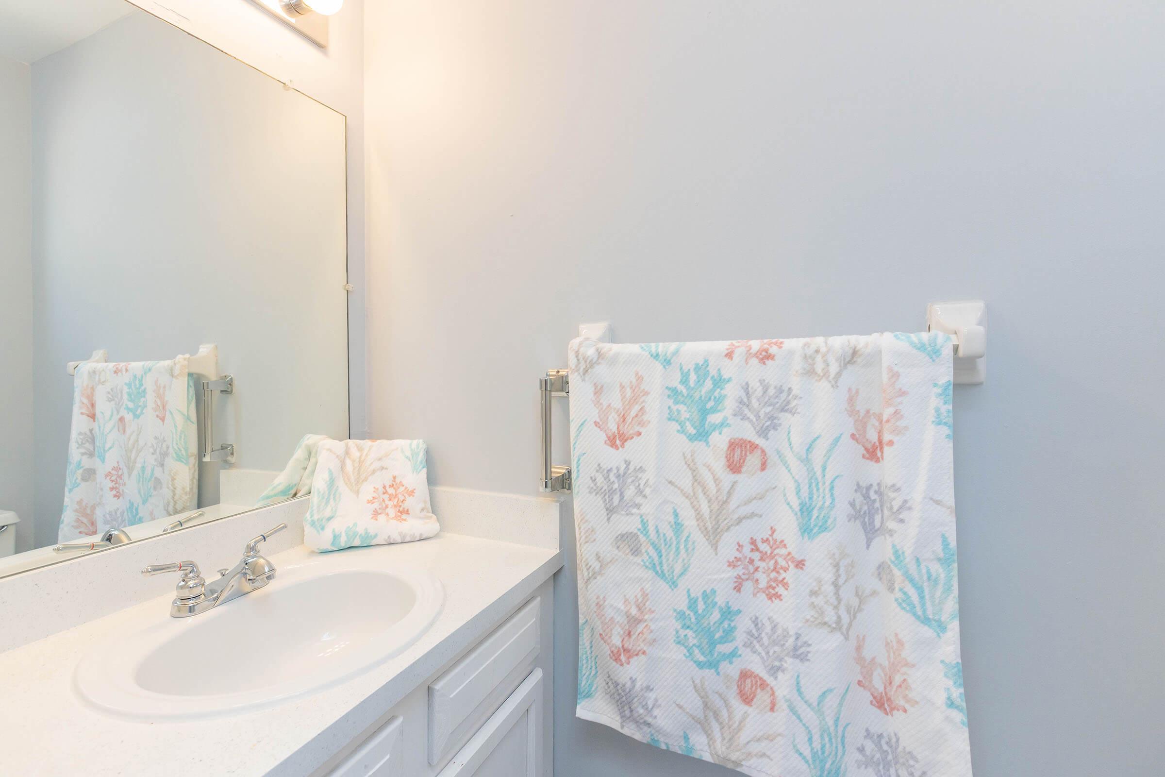 a bedroom with a shower and a sink