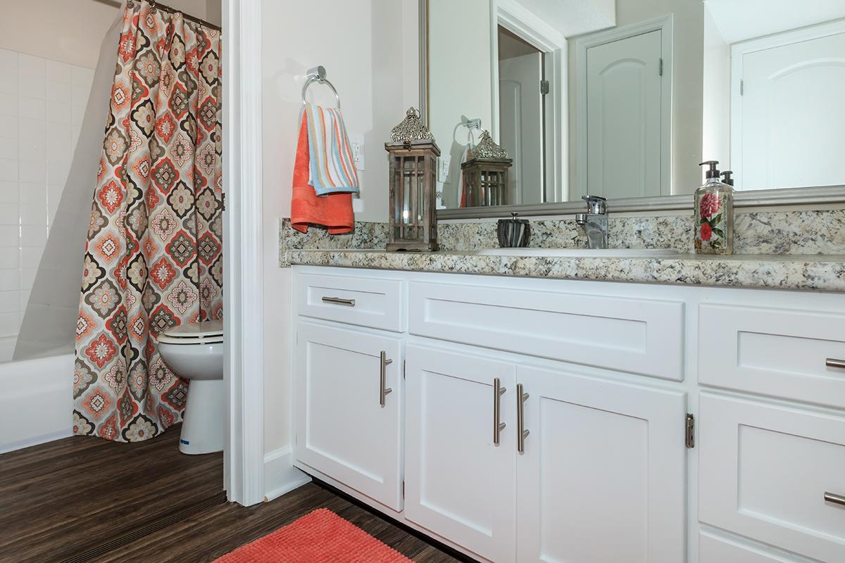 a kitchen with a sink and a mirror