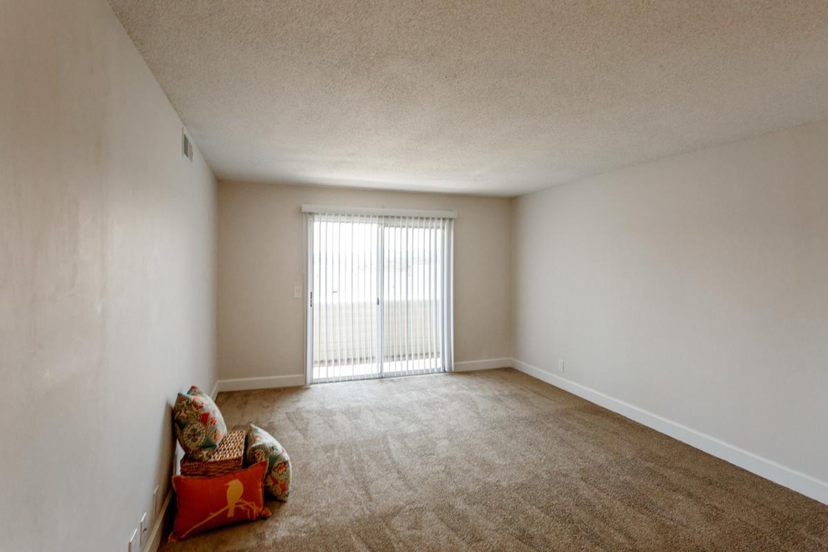 a bedroom with a bed in a room