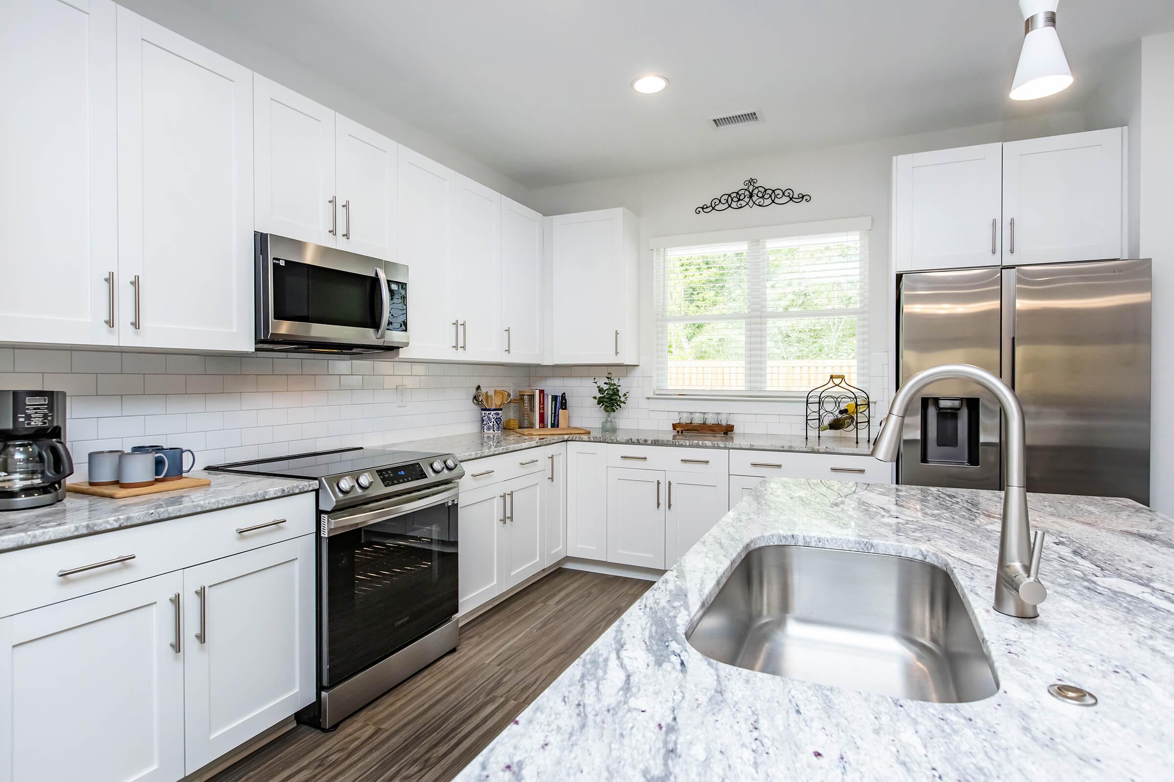 a modern kitchen with stainless steel appliances