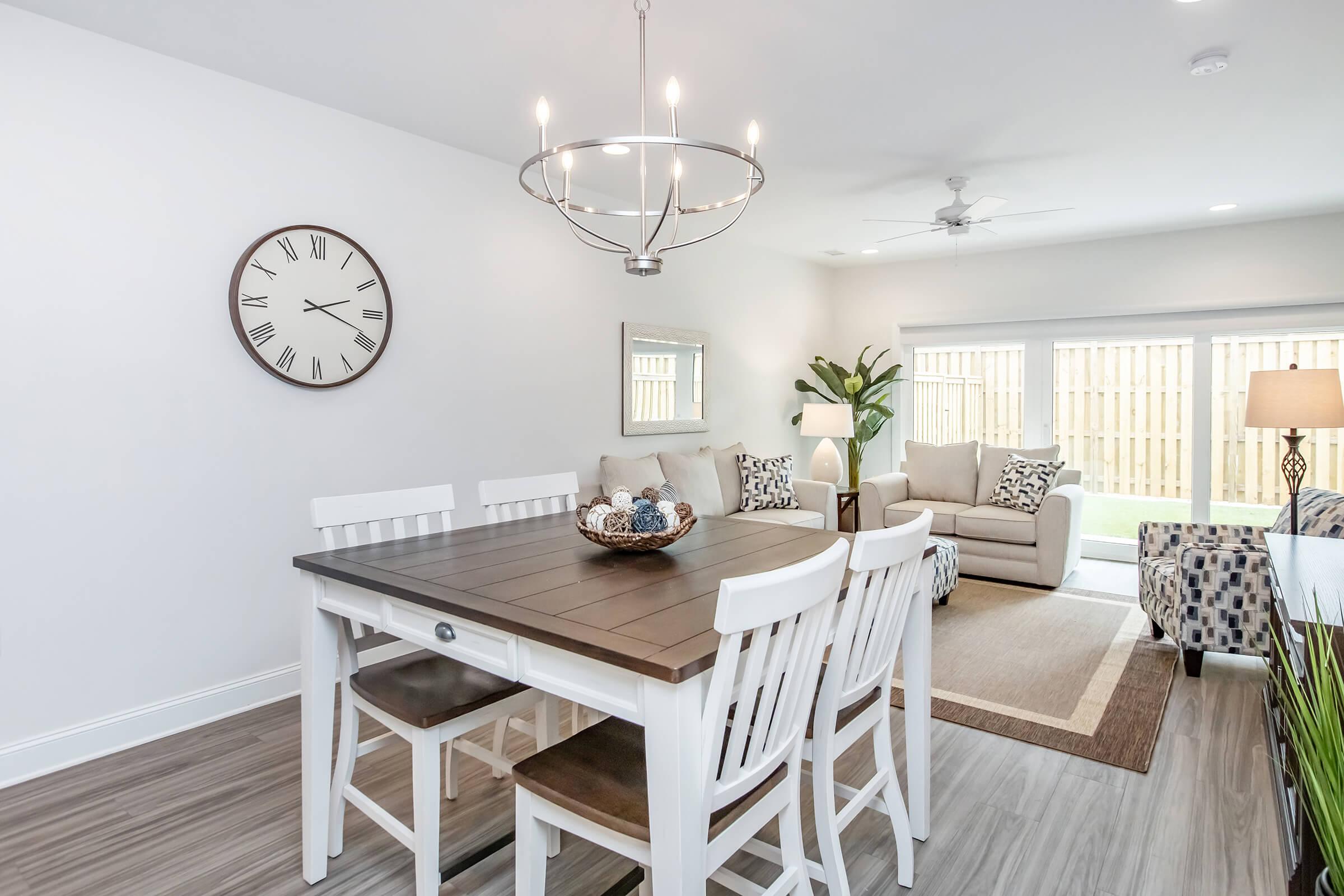 a room that has a clock on a table