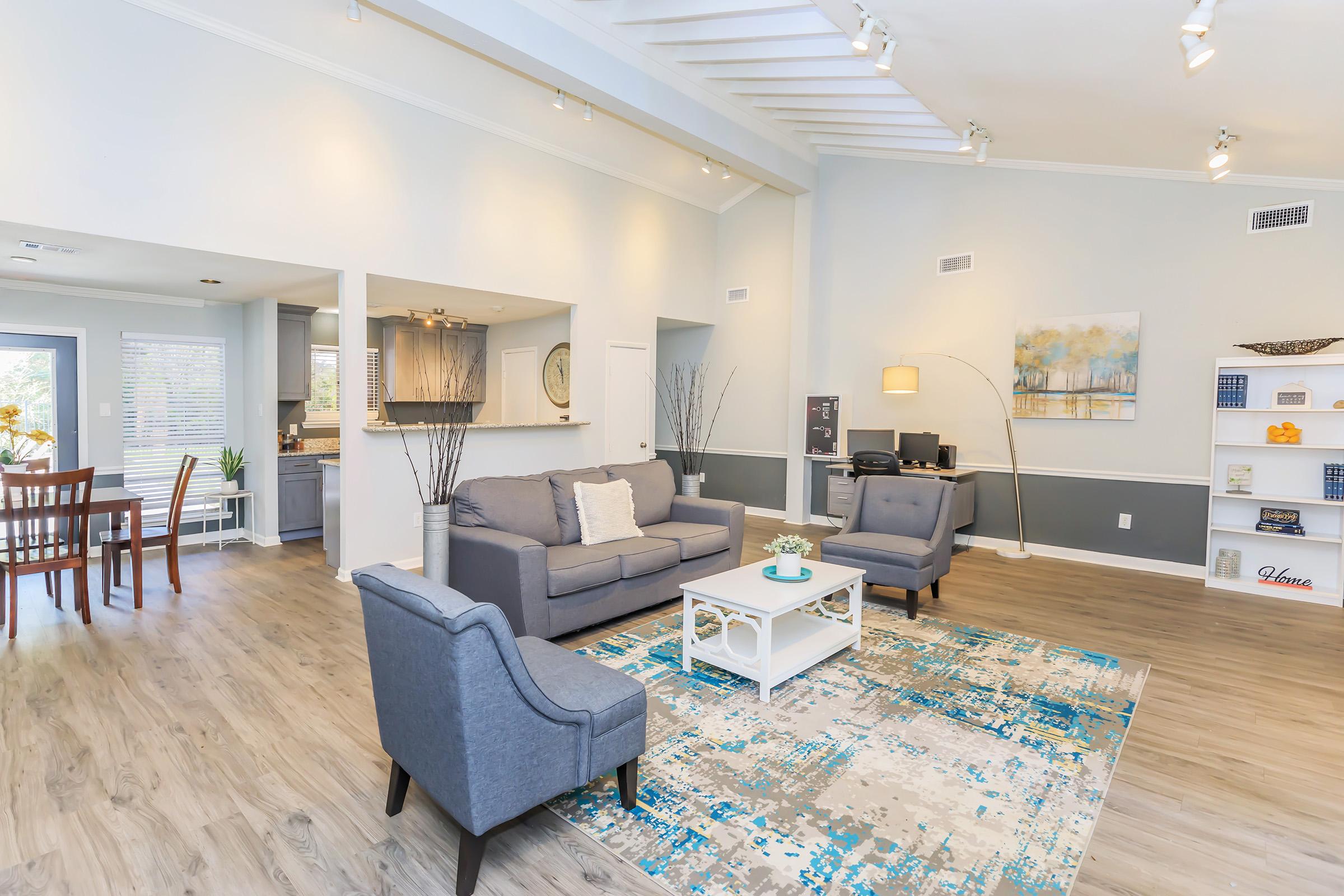 a living room filled with furniture and a table