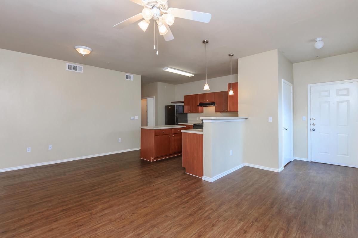 a large empty room with a wood floor