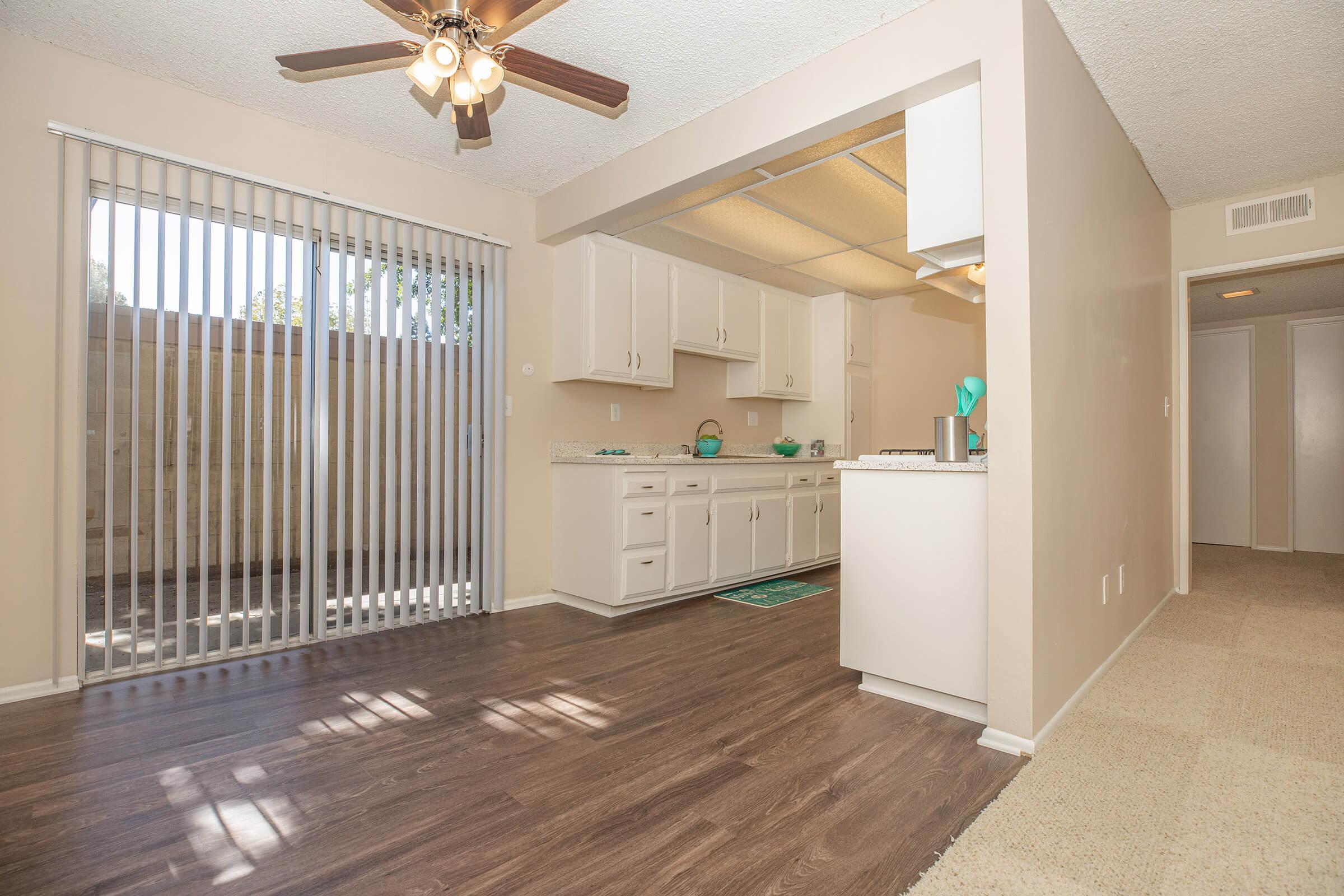 a room filled with furniture and a large window