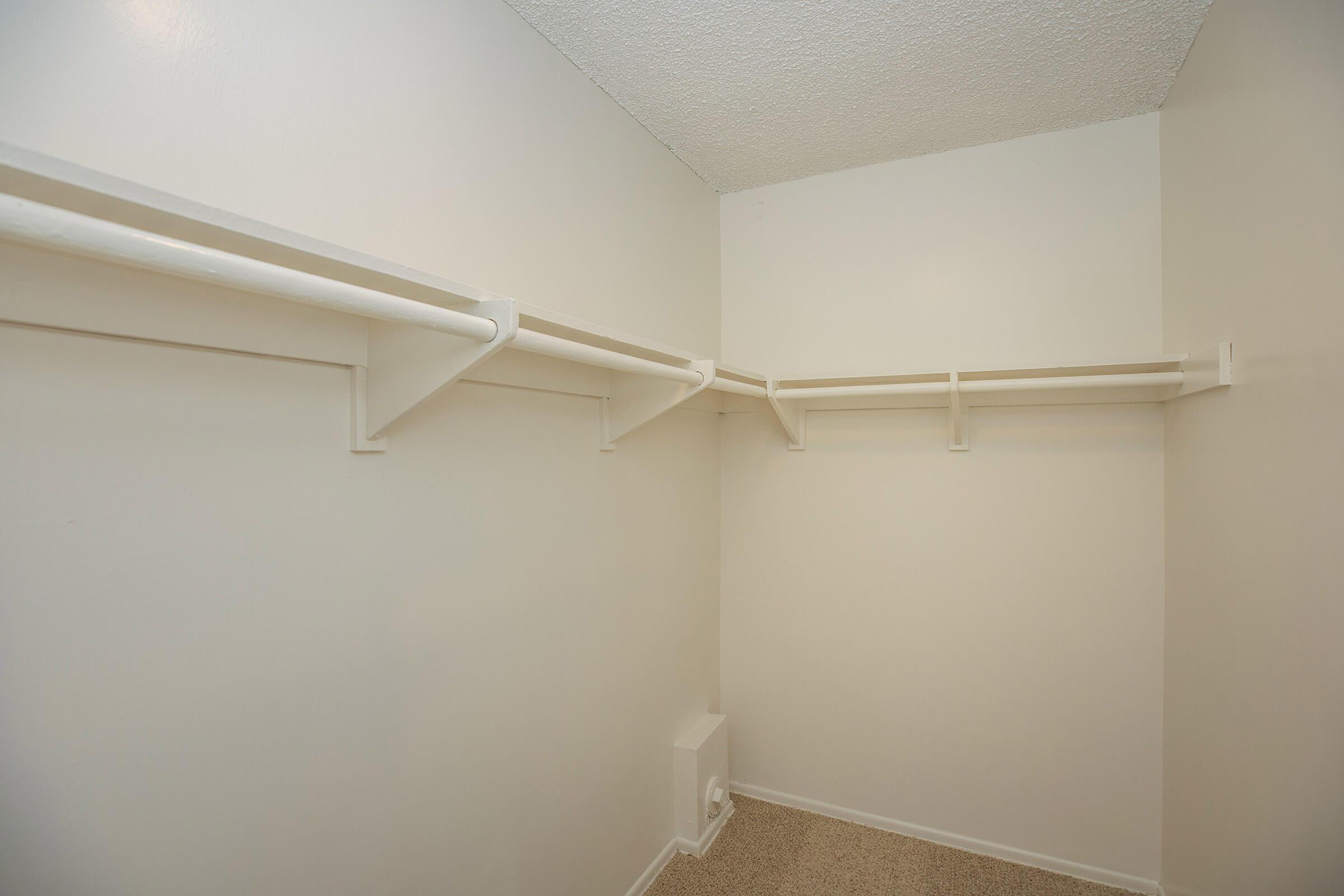 a white tub sitting next to a shower