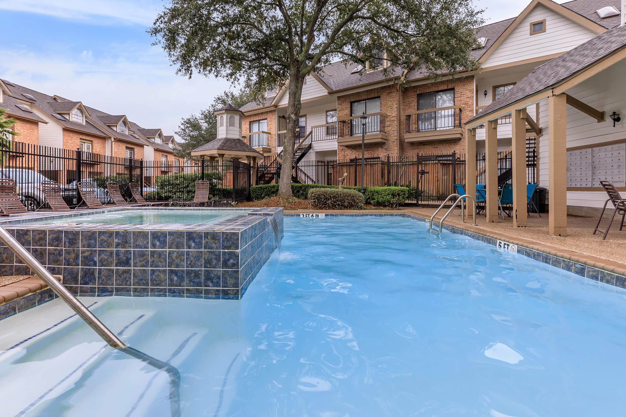 a house with a large pool of water