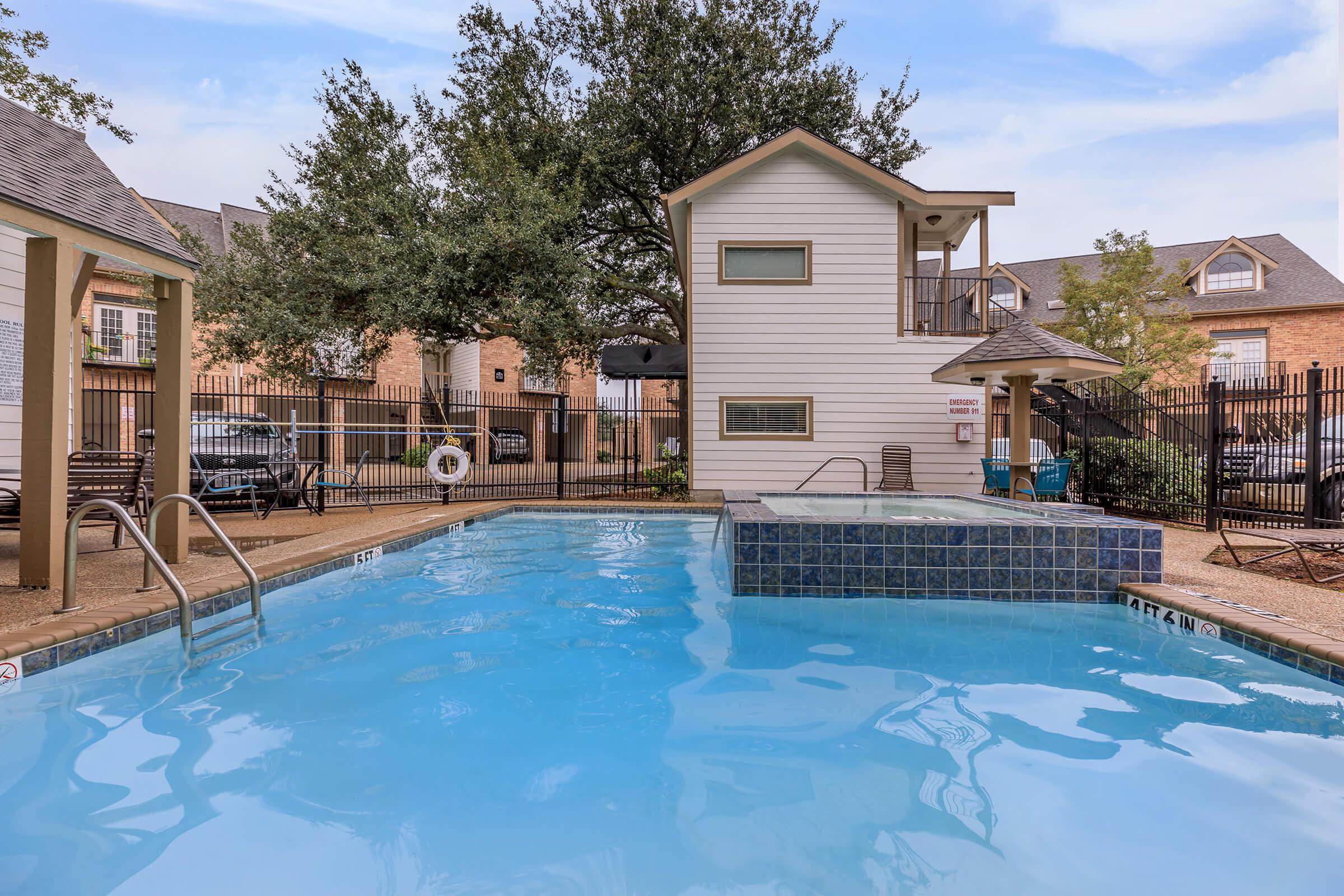 a house with a large pool of water