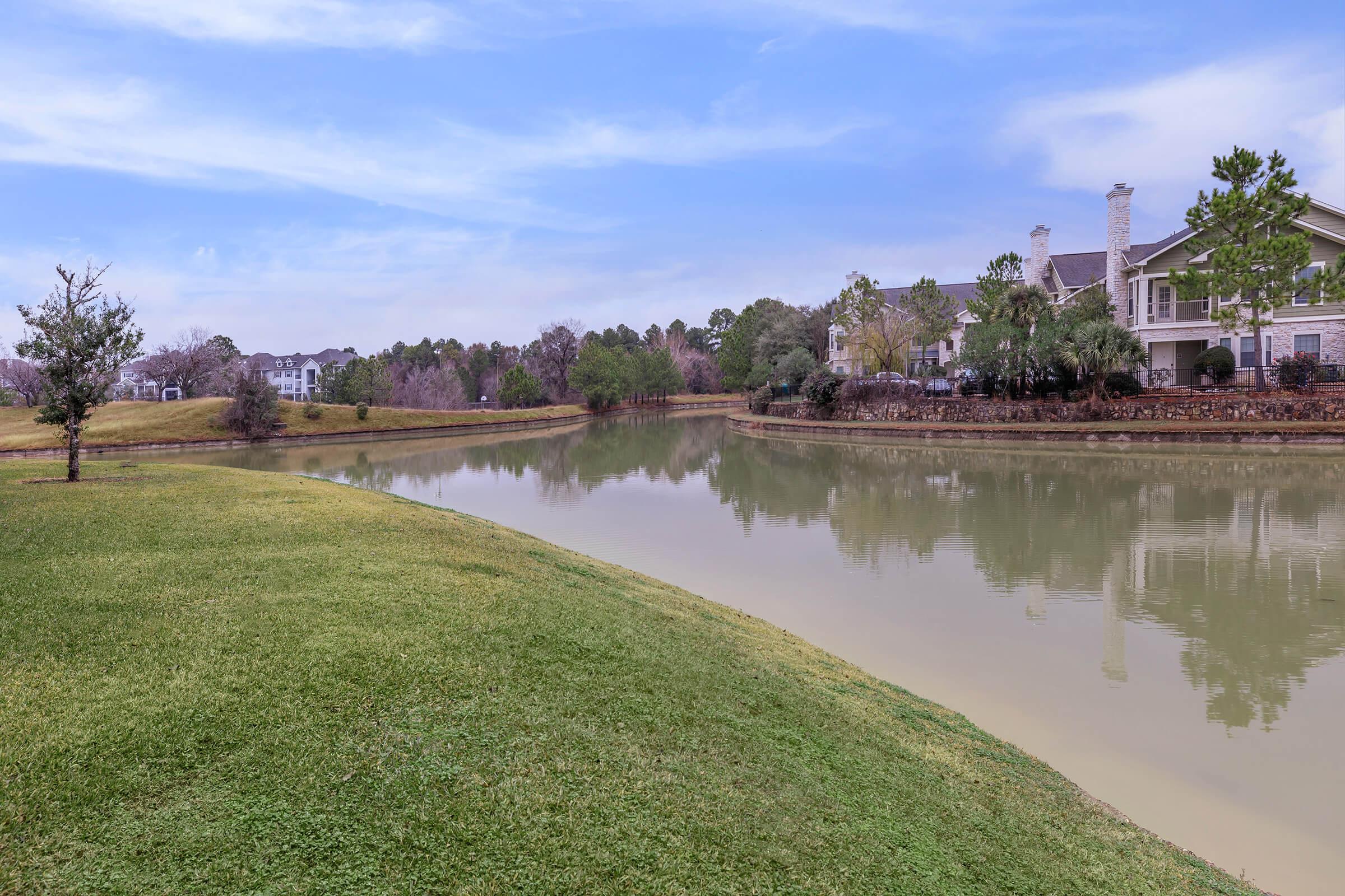 a river next to a body of water