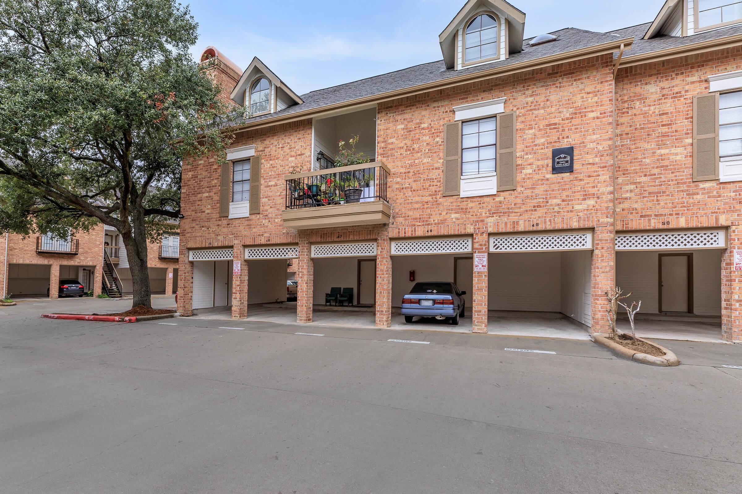 a close up of a street in front of a brick building