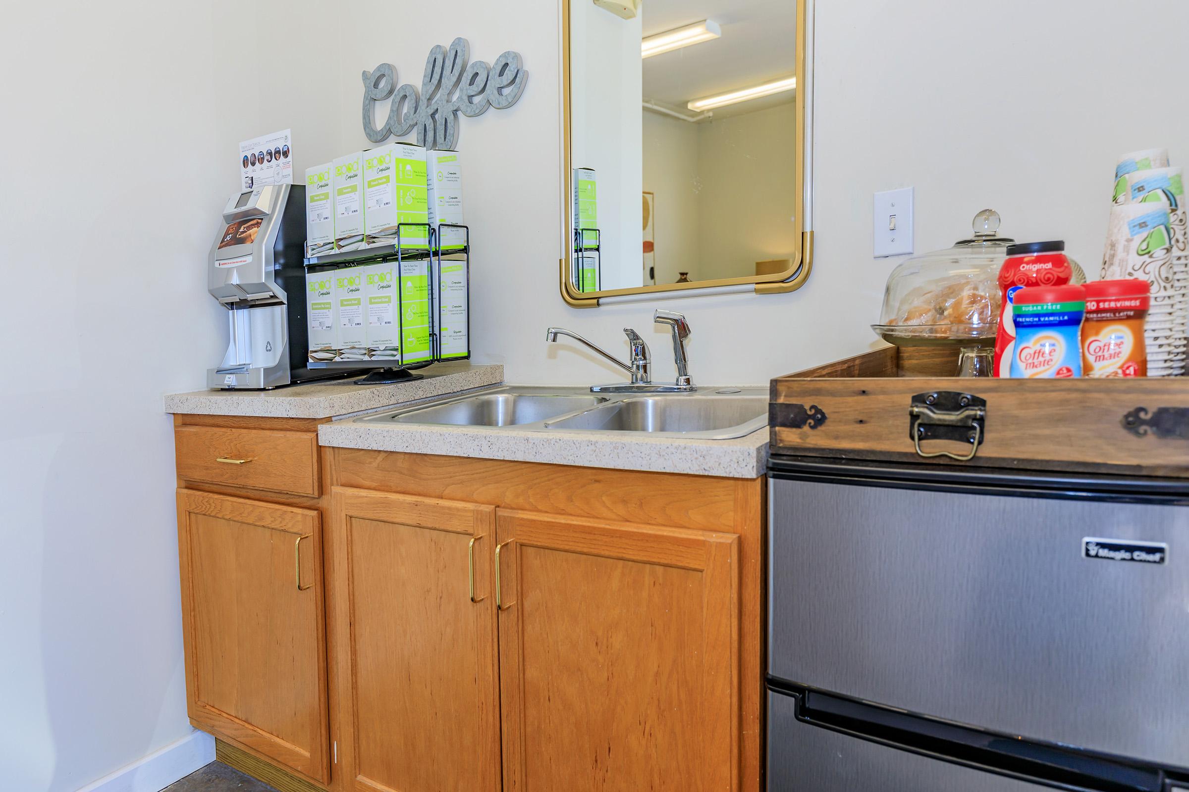 a stove top oven sitting inside of a kitchen