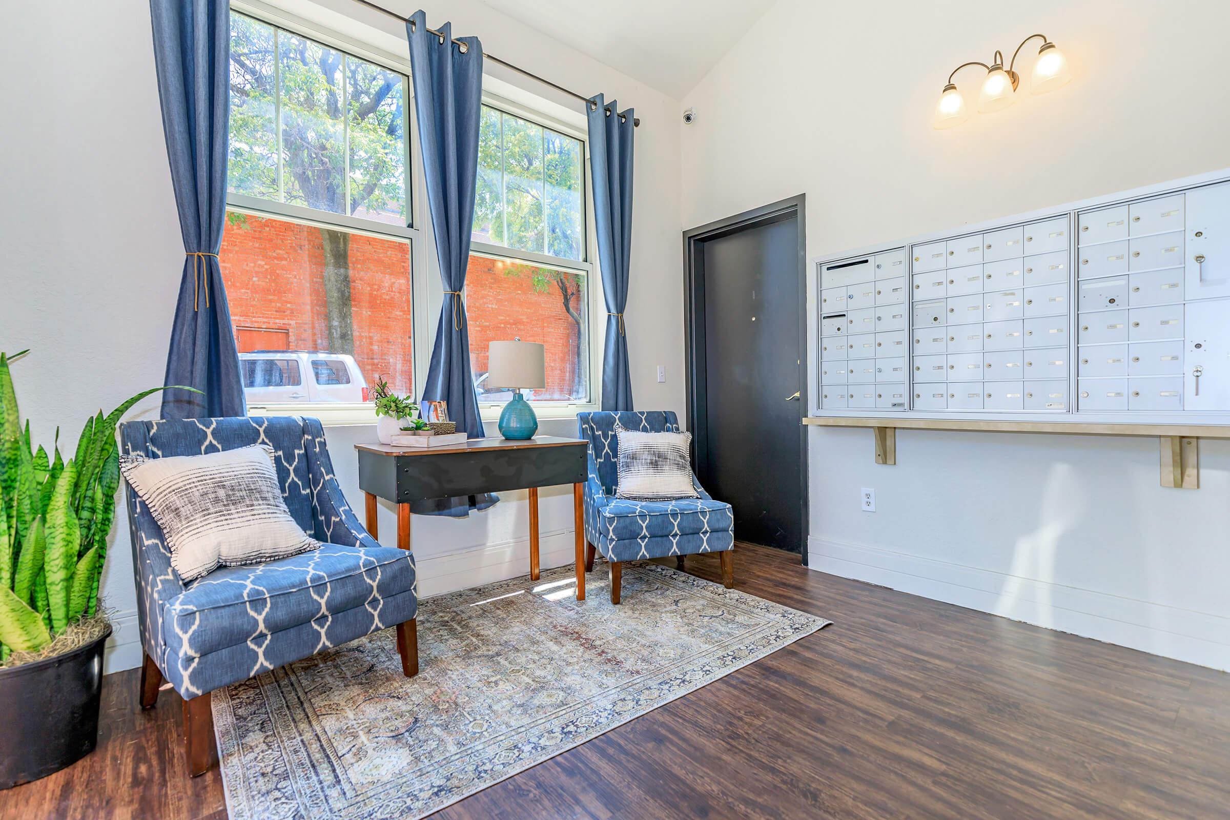 a living room filled with furniture and a large window