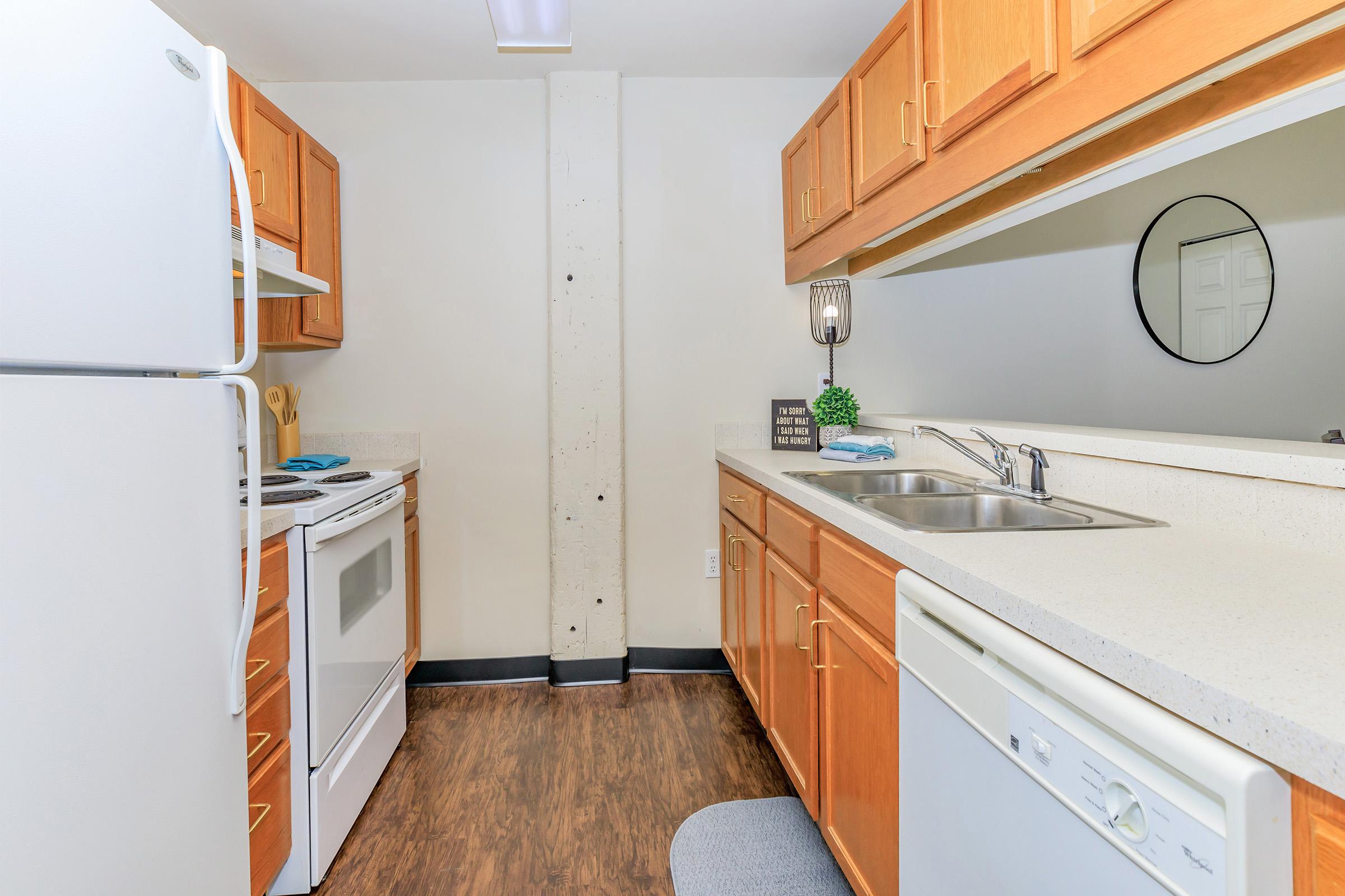 a kitchen with a stove and a refrigerator