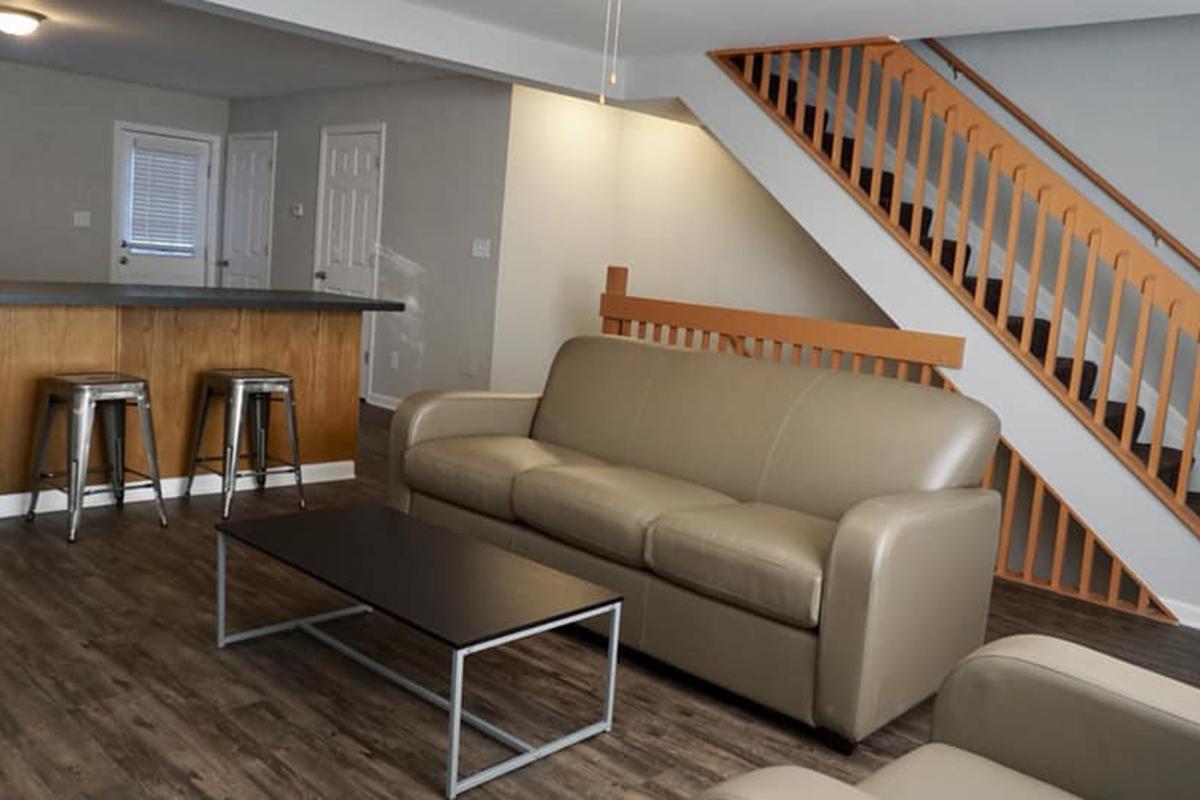 a living room with a leather chair