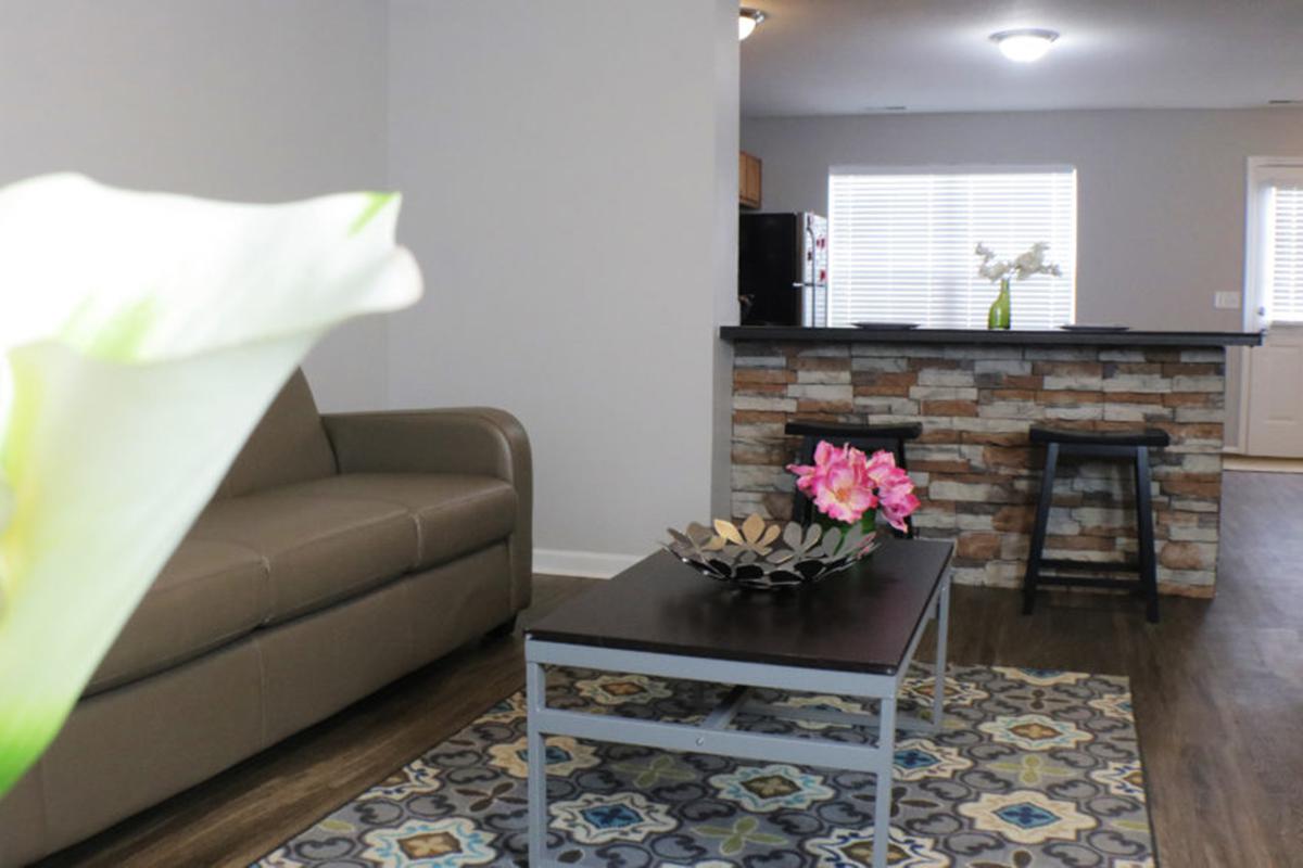 a living room filled with furniture and a fireplace