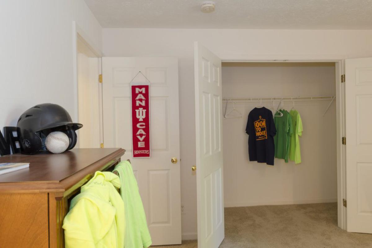 a kitchen with a white refrigerator freezer sitting in a room