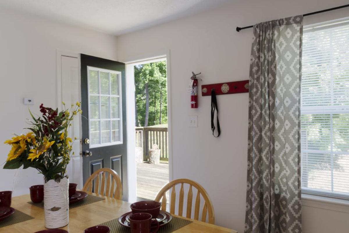 a dining room table in front of a window