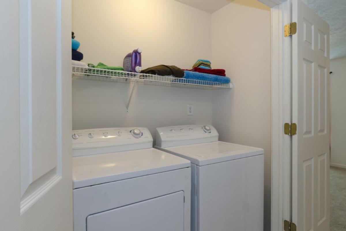 a white refrigerator freezer sitting next to a sink