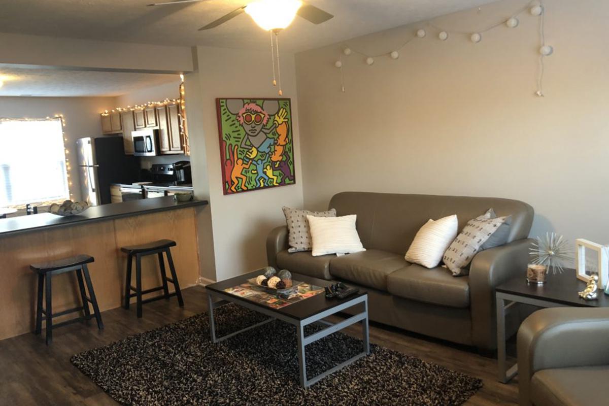 a living room filled with furniture and a table