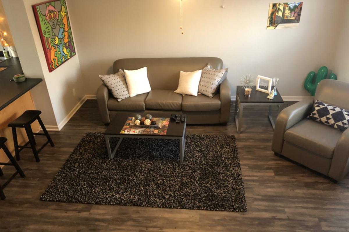 a living room with a couch and a chair