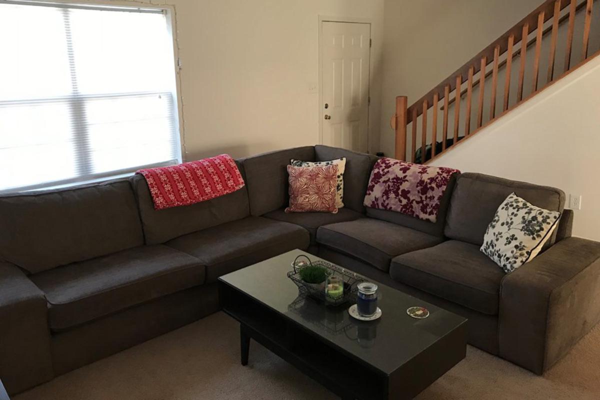 a living room filled with furniture and a flat screen tv