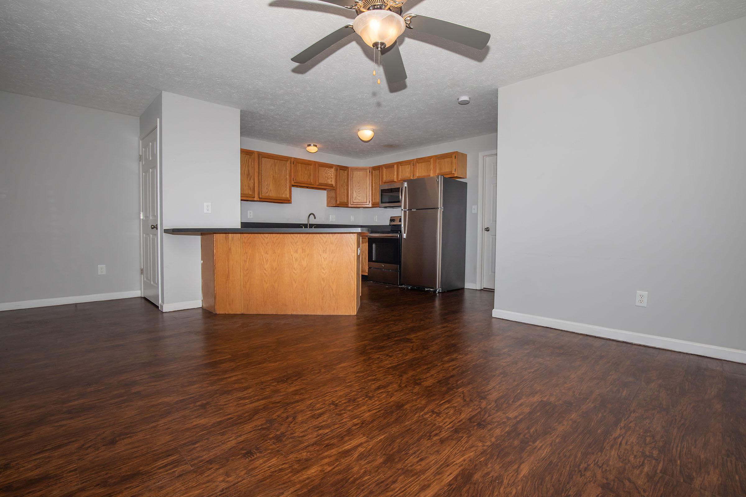 a kitchen with a wood floor