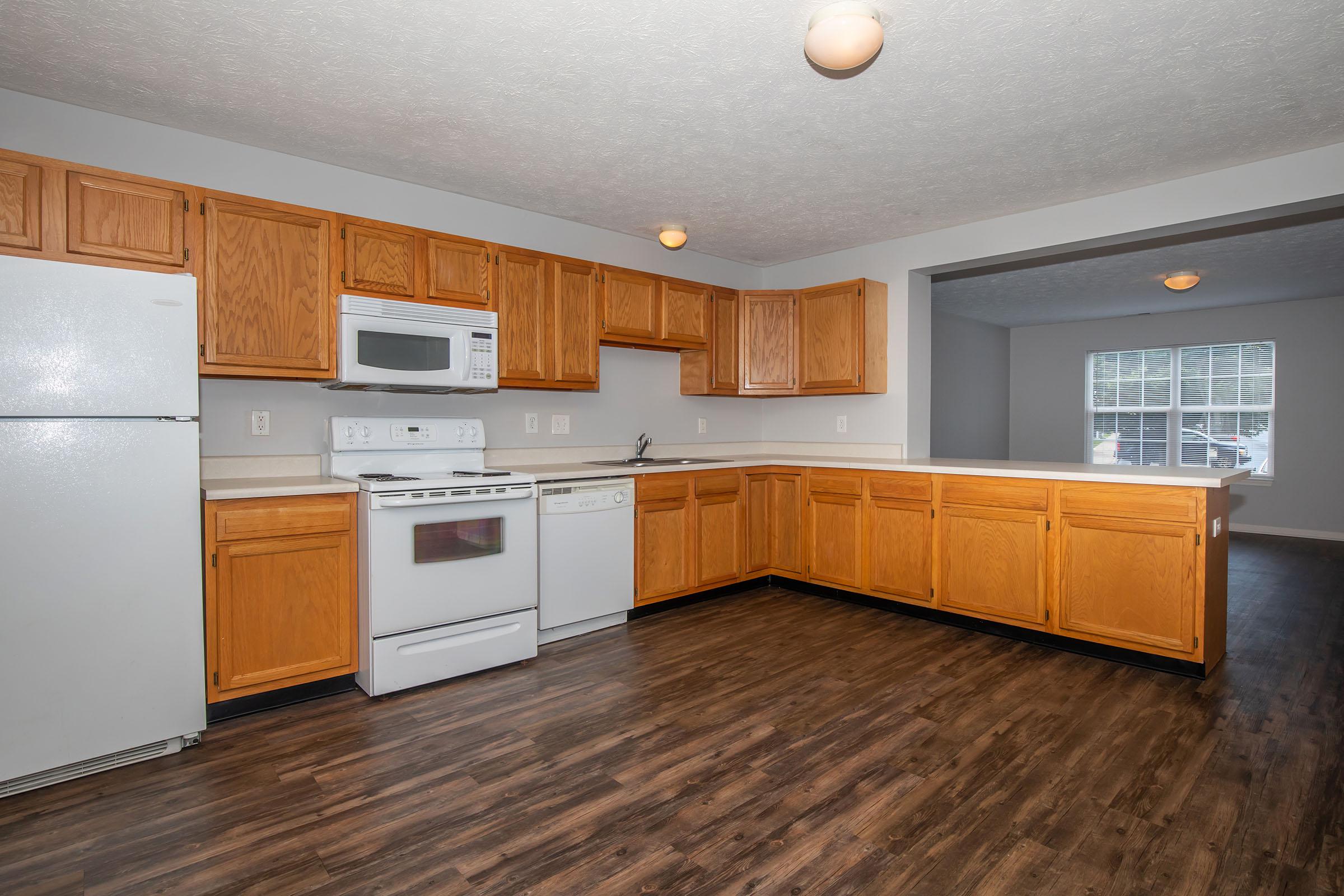 a kitchen with a wood floor