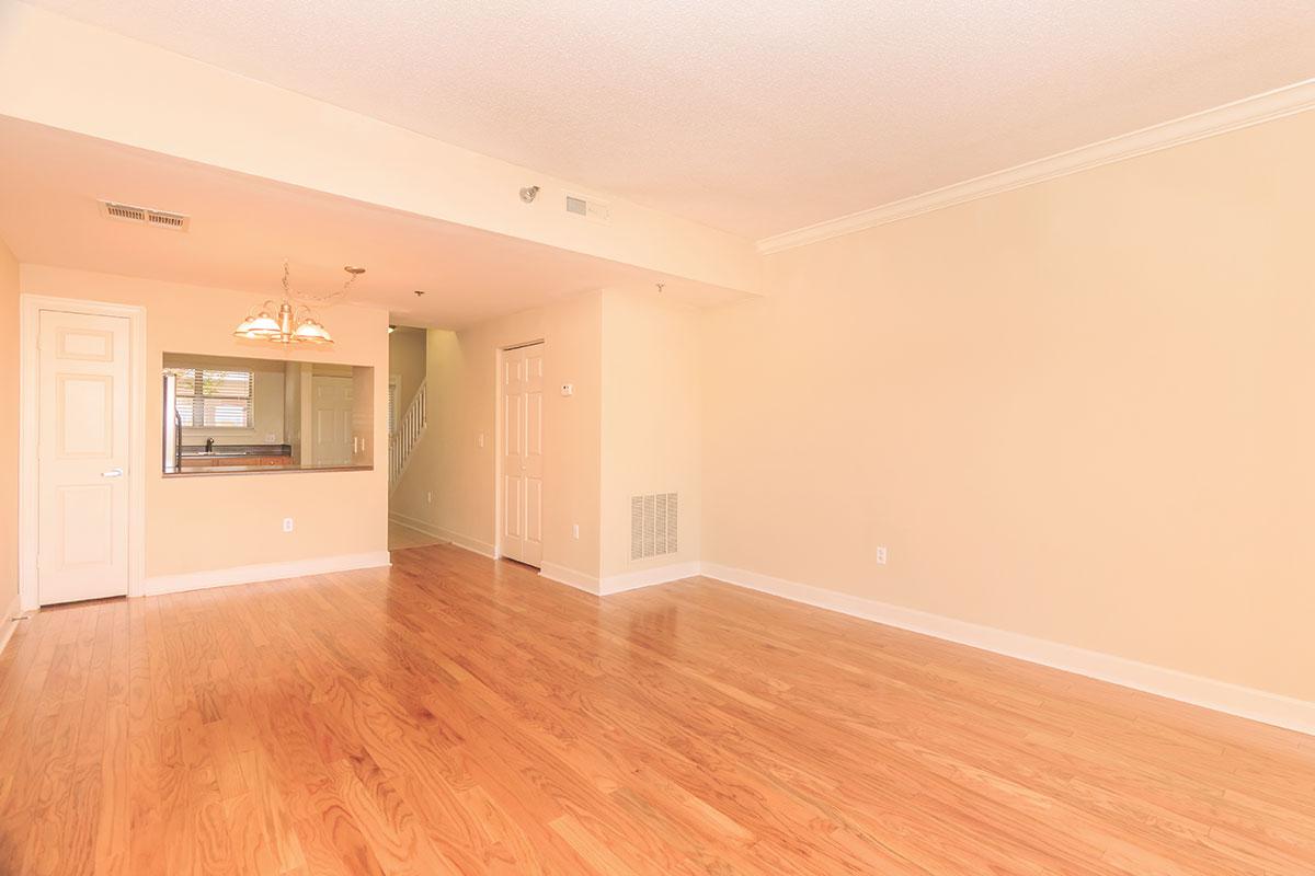 a large empty room with a wood floor