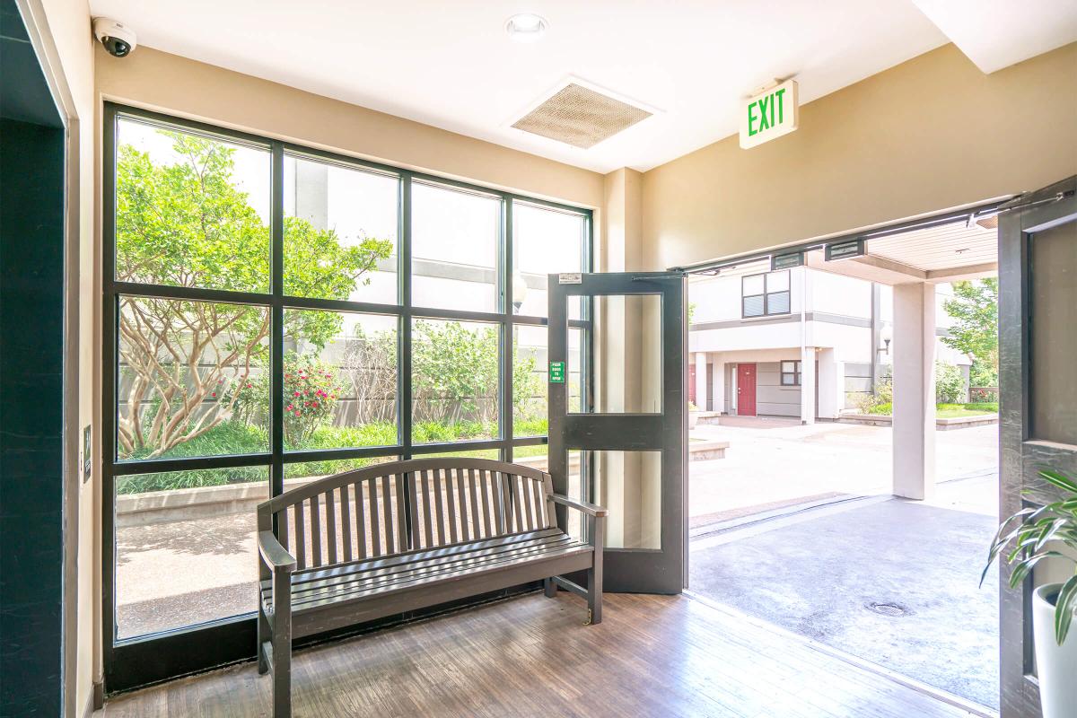 a room filled with furniture and a large window