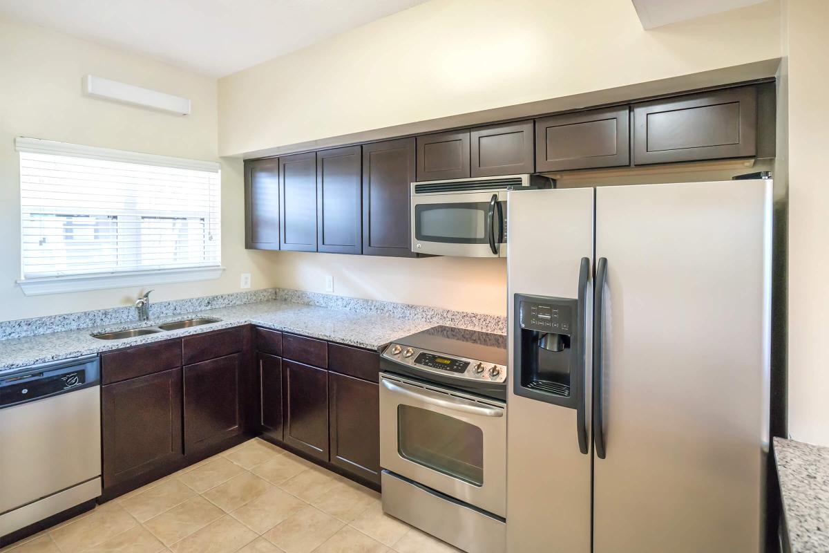 a large kitchen with stainless steel appliances