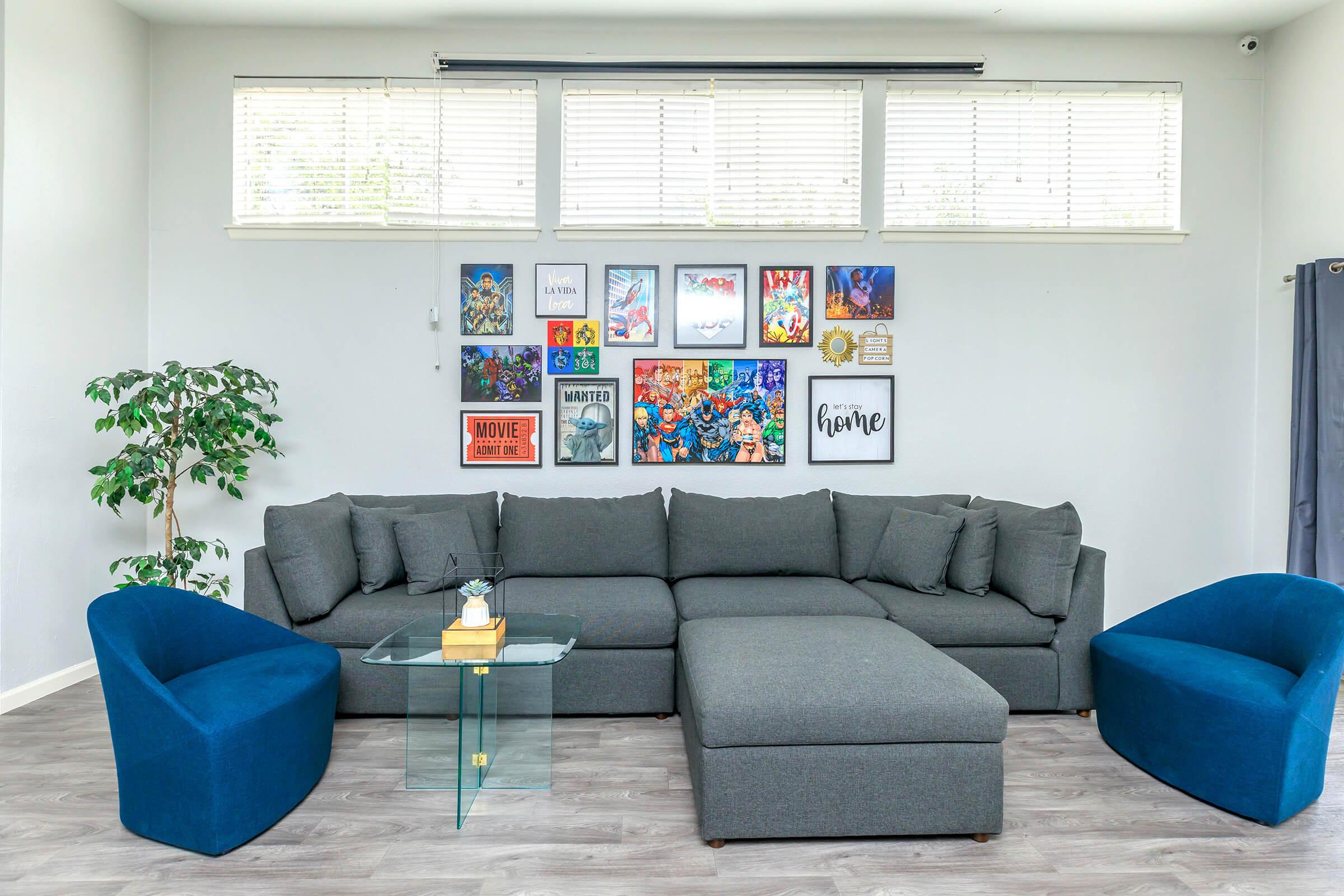 a living room with a blue seat