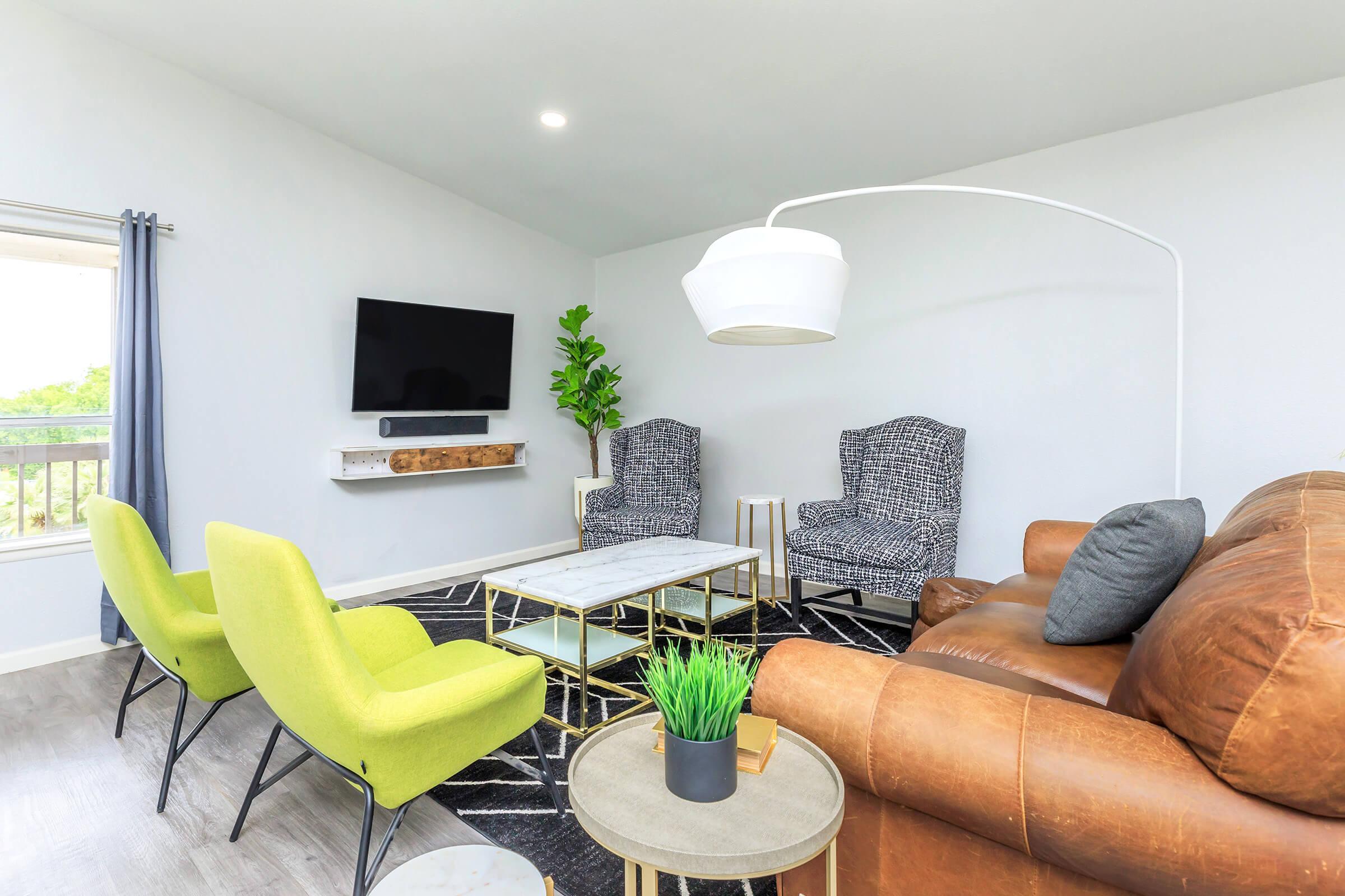 a living room with a leather chair