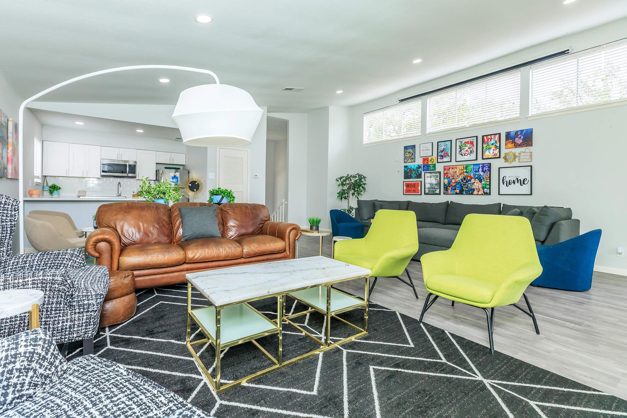 a living room filled with furniture and a large window