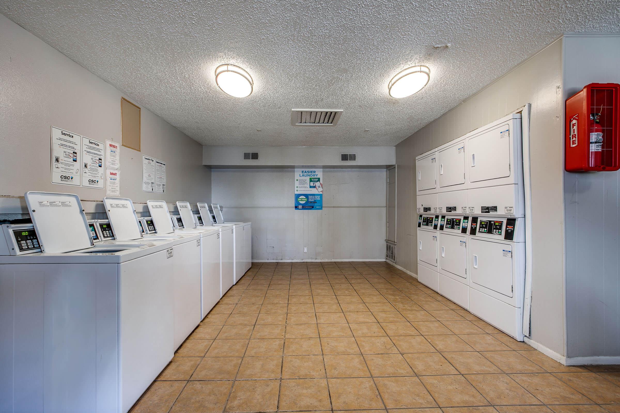 a large kitchen with stainless steel appliances