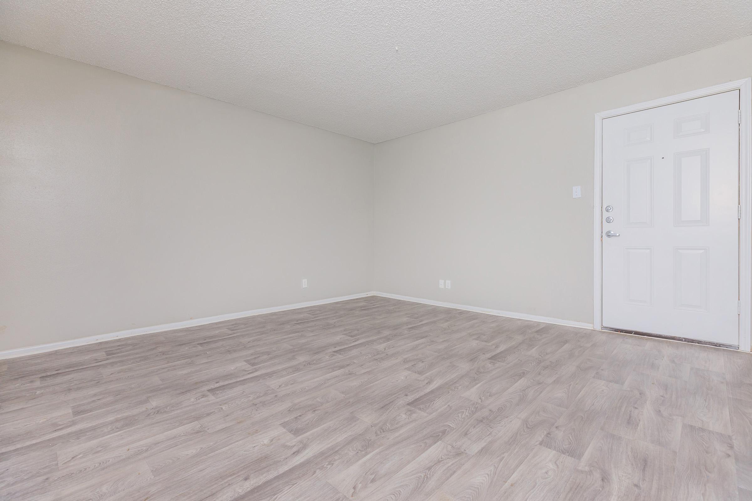 a bedroom with a building in the background