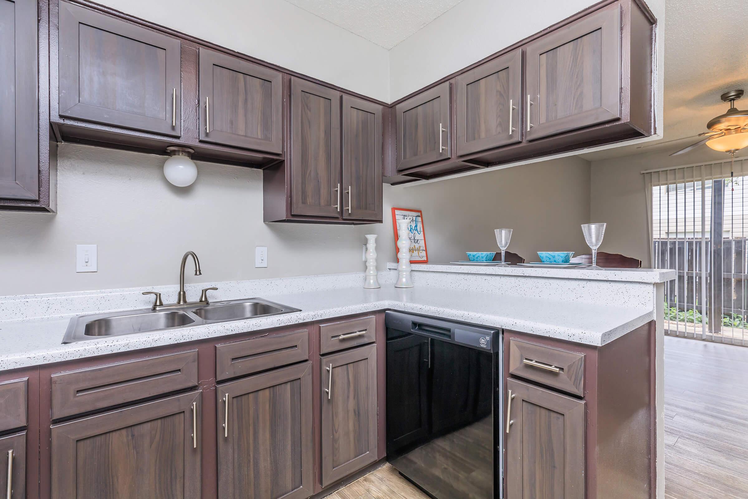 a kitchen with a sink and a microwave