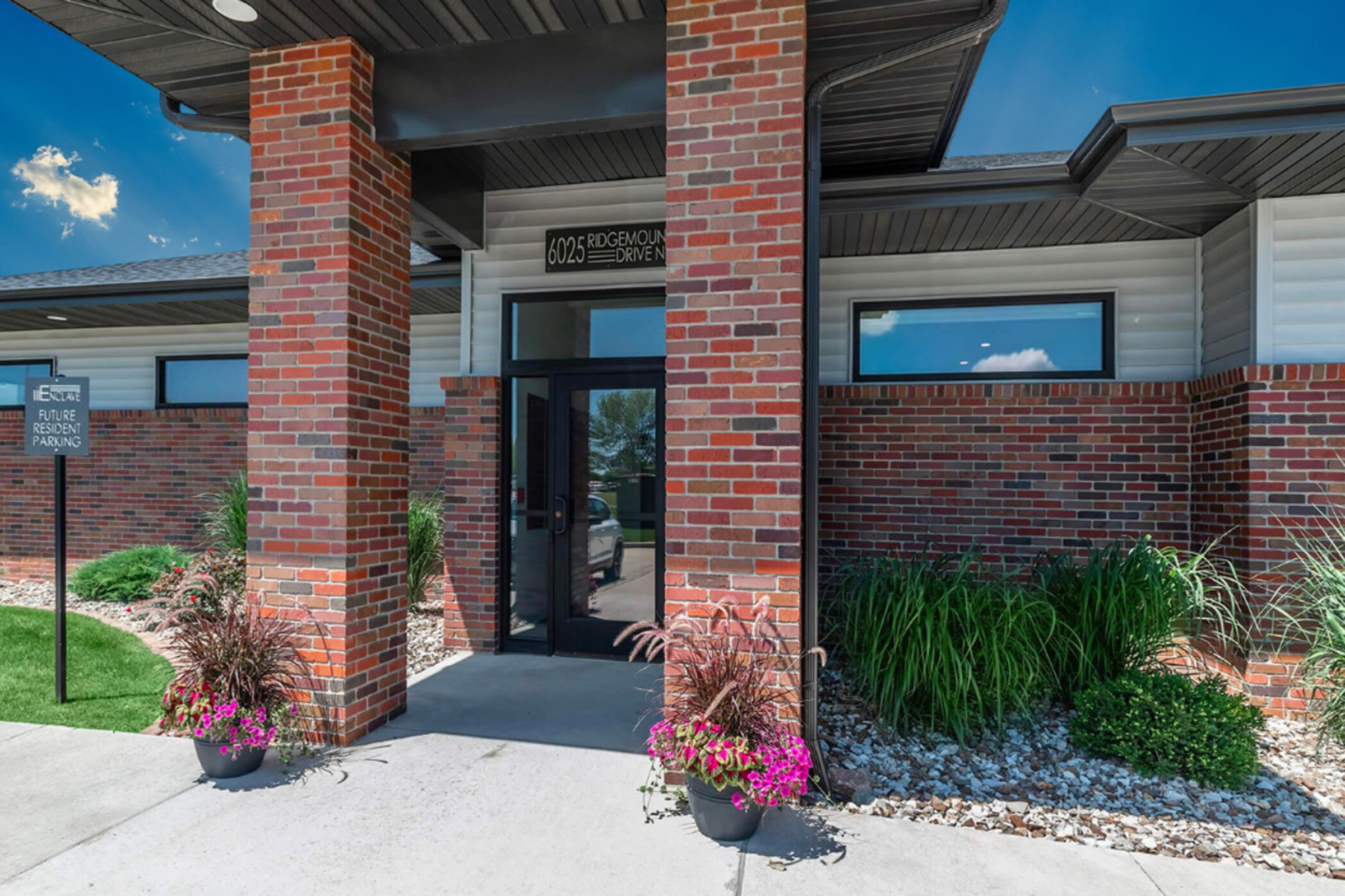 a person standing in front of a brick building