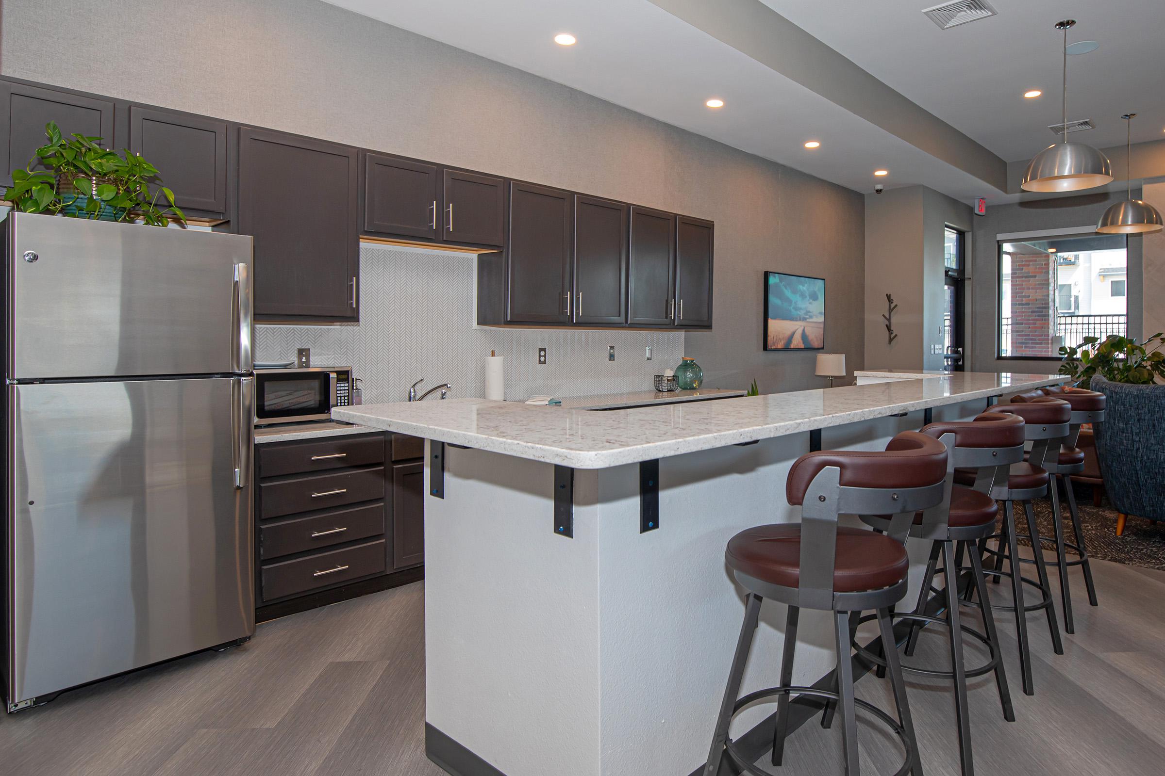 a kitchen with a dining room table