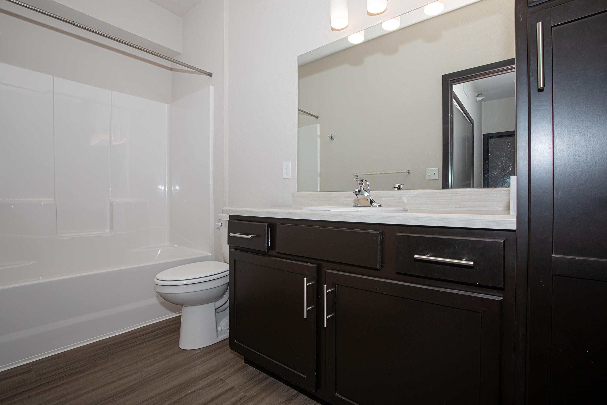 a kitchen with a sink and a mirror