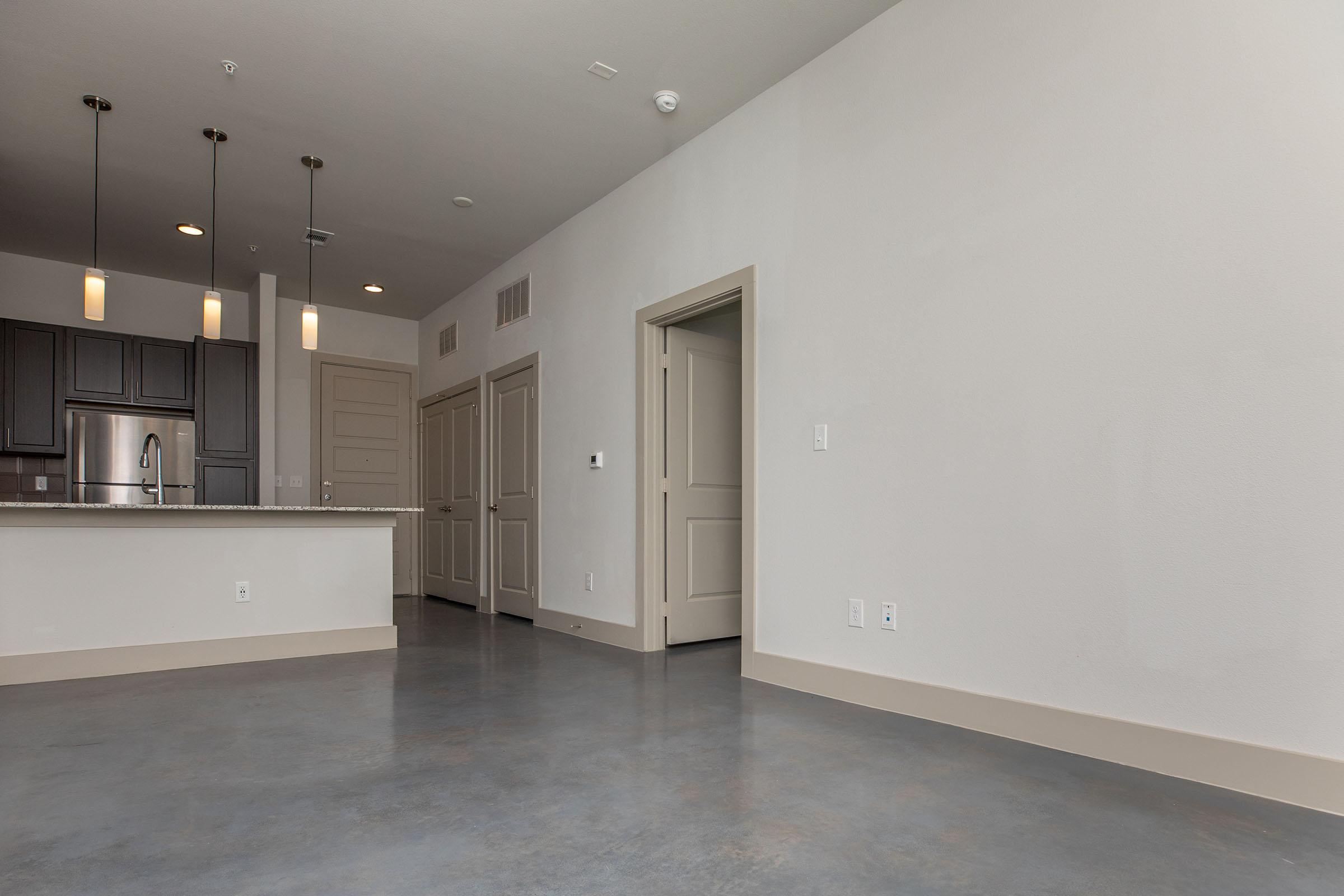 a kitchen with a building in the background