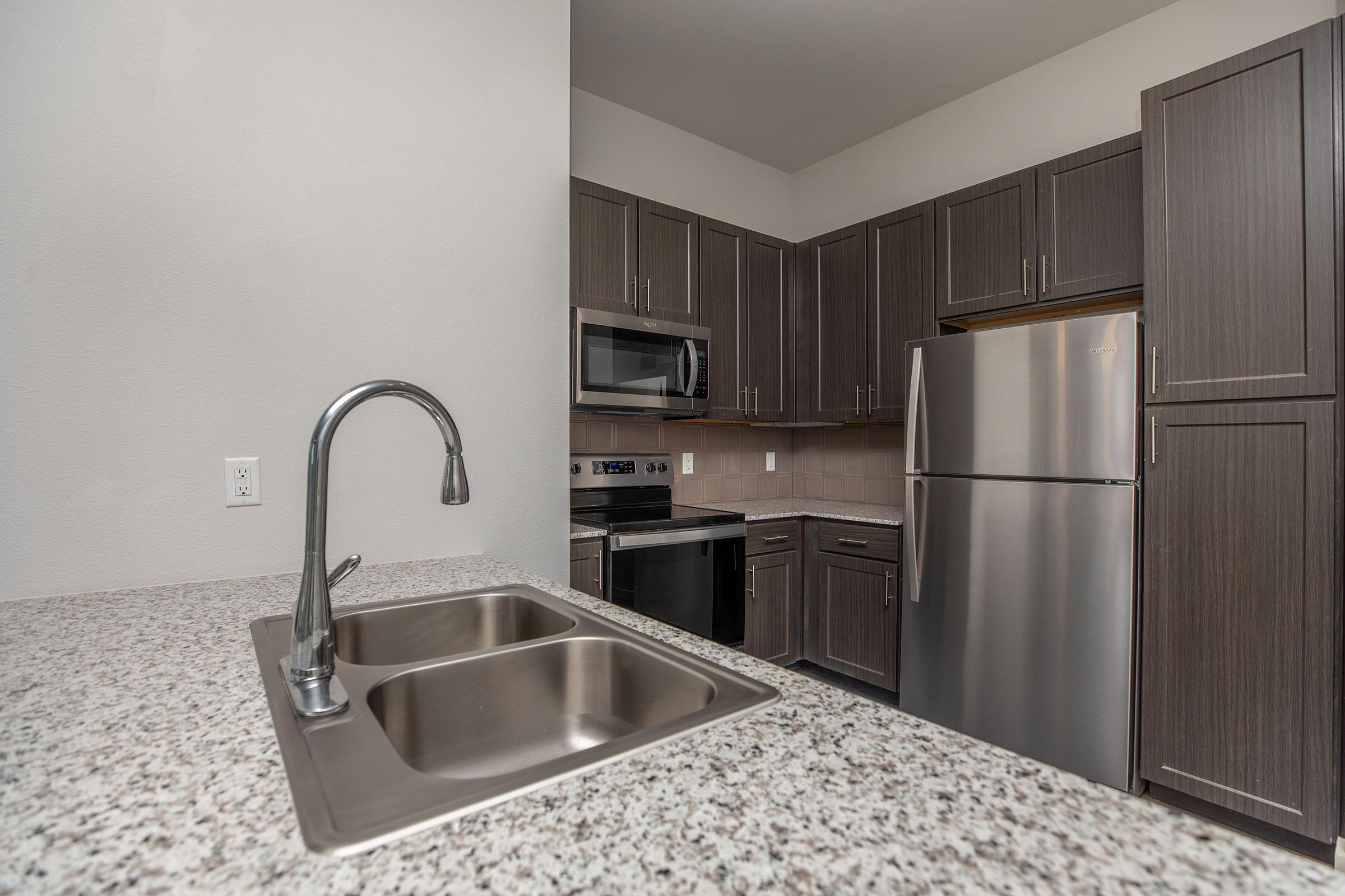 a modern kitchen with stainless steel appliances