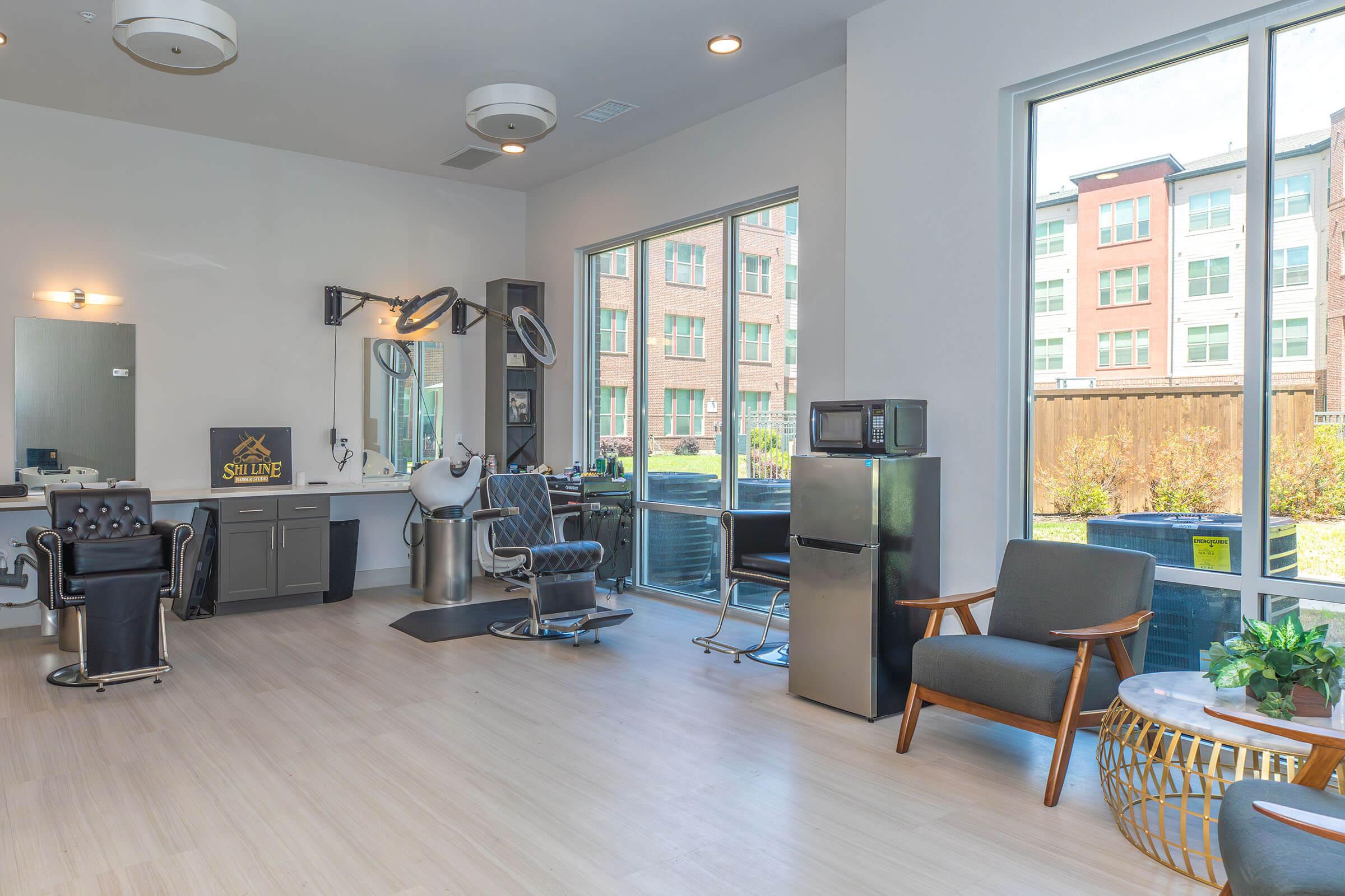 a living room filled with furniture and a large window