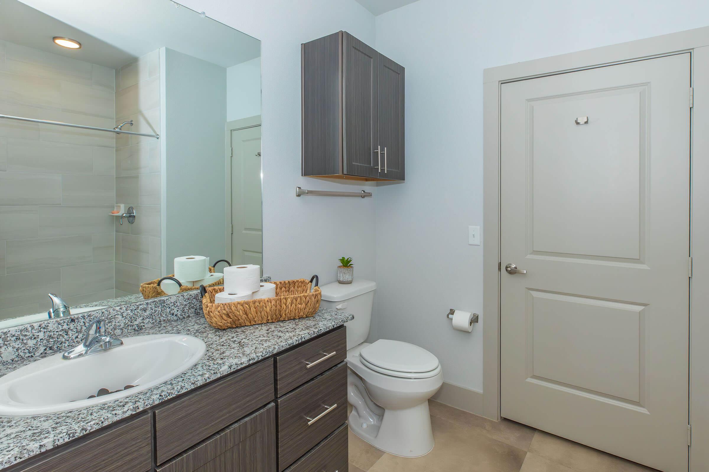 a kitchen with a sink and a mirror