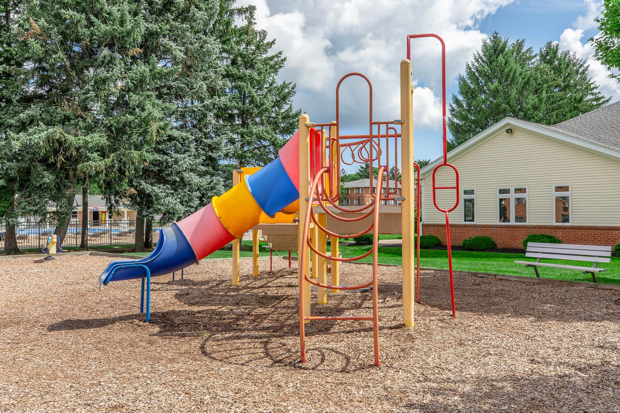 a chair sitting in front of a playground